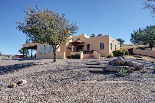 Classy Southwest style home w/ guest house on 5 acres. Fantastic views of the Santa Rita Mountains! Home comes furnished with beautiful Western decor,  newly remodeled Kitchen and Bathrooms. Large Living room with ''Wells'' Fire place, Real Wood Beams on ceiling and rustic western light fixtures, built-in book shelves w/ storage. High ceilings with clear story windows.  Separate Guest house has kitchen, one bedroom, one bath with a large extra room to expand for another bedroom or living space. Newer Jacuzzi on back porch of main house.  Private Well with working Windmill & 3,500 Gallon water storage tank. Horse corral w/ small barn, Lots of mature trees on property, 2  storage units + bunker. Lots of other great features to see.