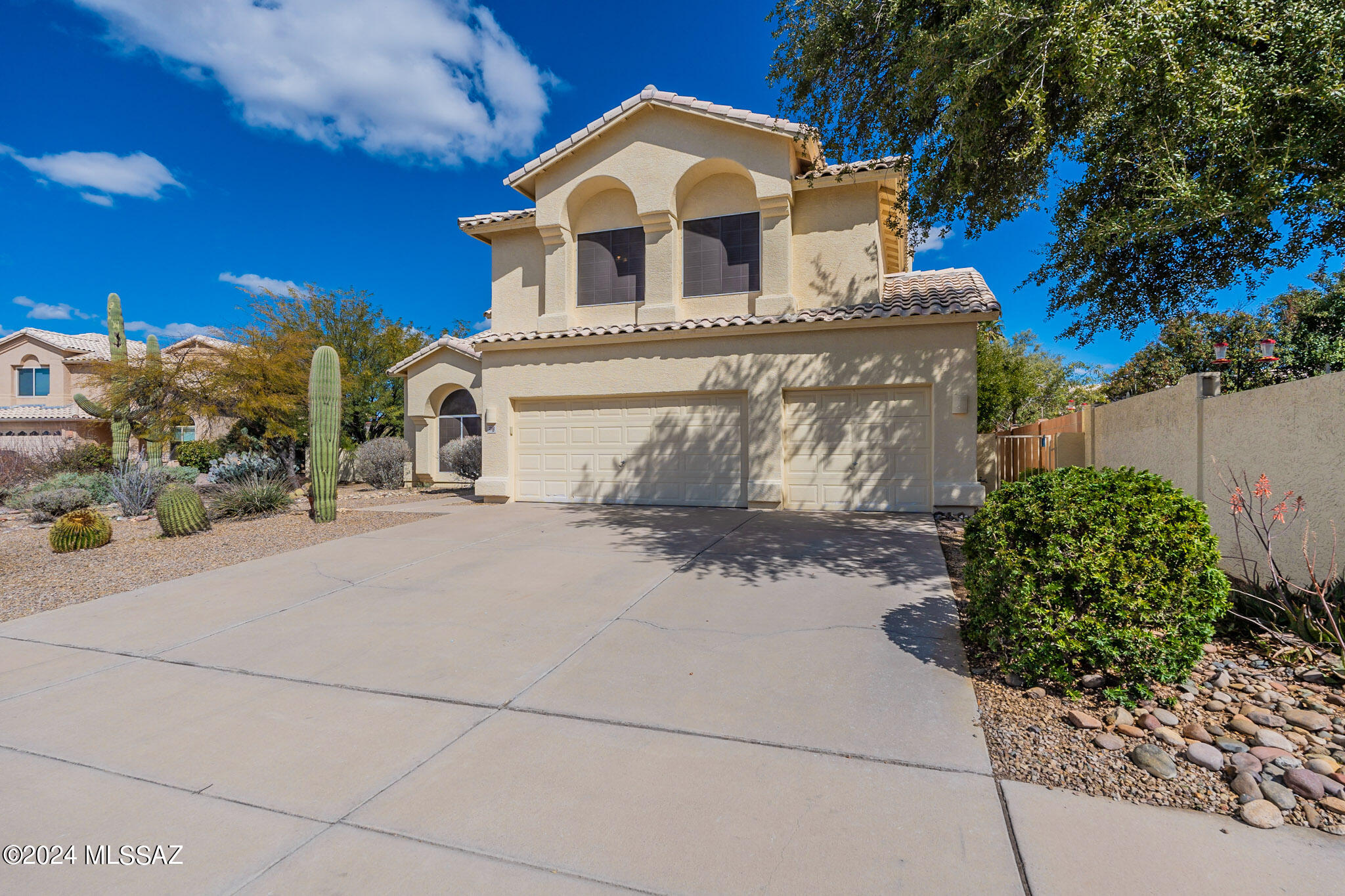 Come see one of the largest floor plans offered in the highly desirable Copper Creek! This home is located in the heart of Oro Valley on a cul-du-sac. Close to schools, shopping, hiking, and dining. Home consists of a generous ground floor including a large living, dining, and family room. Three car garage, laundry (including laundry shoot from upstairs 2nd bath) and a den and full bath with exterior entrance for when your using the generously sized sparkling pool. Upstairs has a large master bedroom and bathroom and sitting area that could be converted into a 5th bedroom. Upstairs also has 2 more bedrooms and a full bath. Step outside into the substantial back yard on this quarter acre lot. The large pool sparkles and is ready for this summer!