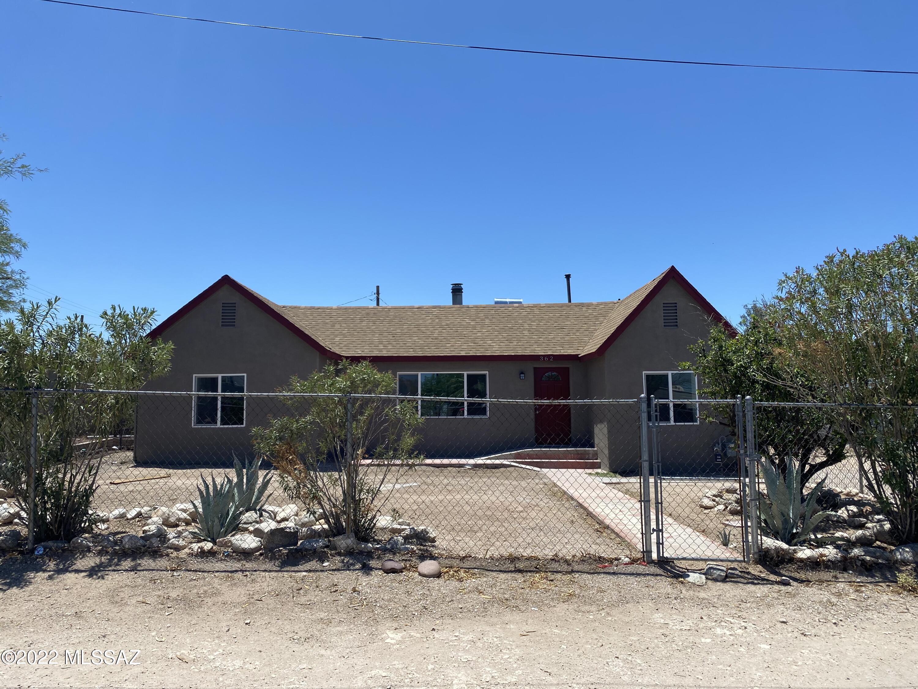 Beautifully remodeled 5BD 3BA house with office centrally located close to downtown and the freeway on a large lot. Open living area with lots of light coming in through the new dual pane windows. Private guest quarters with separate entrance has a full bath and closet making it the perfect place for family, guests, or even extra work space. The extra large 20x20 workshop privately located behind the house is perfect for the car enthusiast or could be converted to a guest house. The large lot provides ample parking for an RV or the extra car or two.