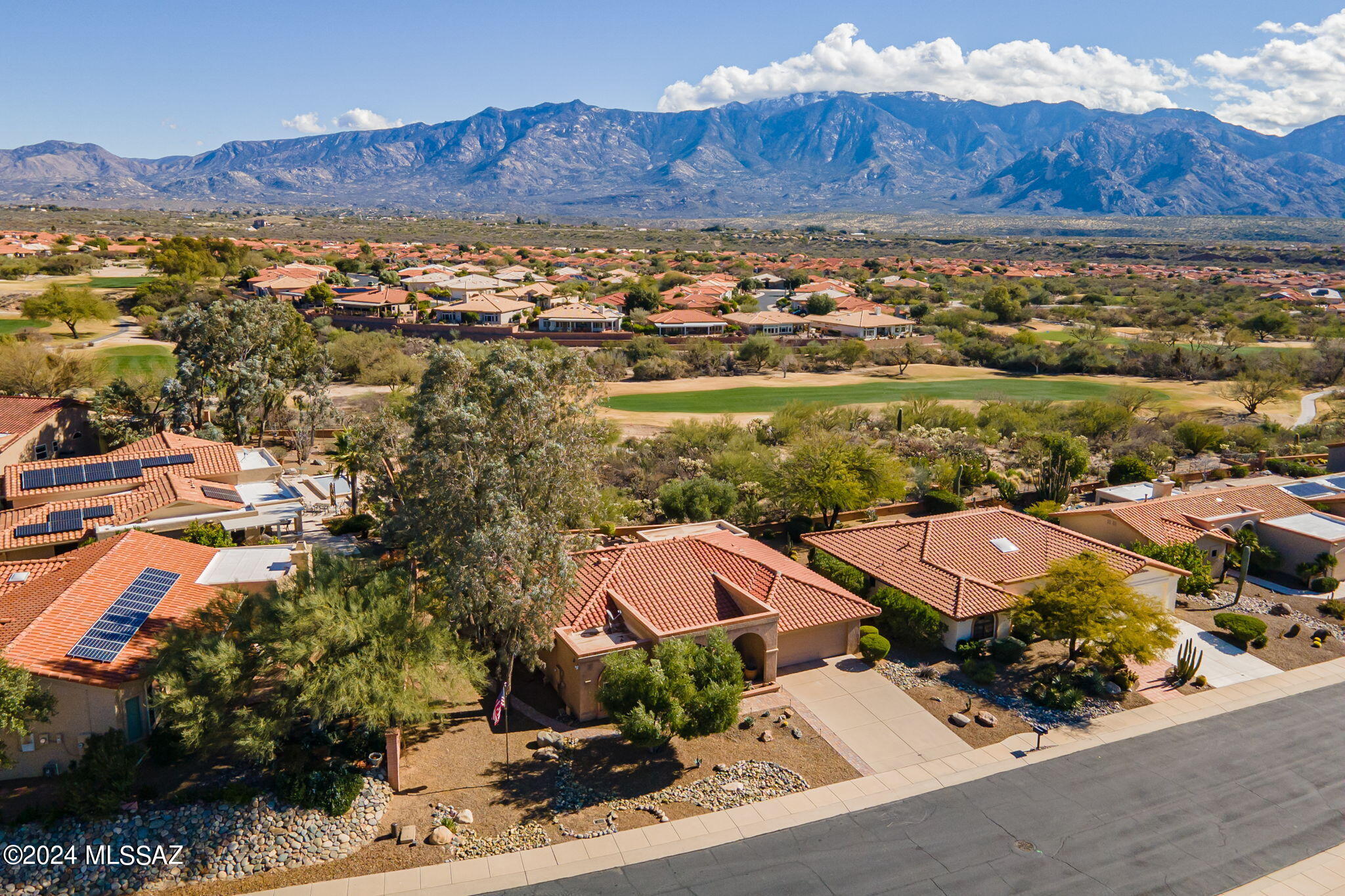 Must see Pacifica Model! Featuring 2 bedrooms, 2 baths, 1750 square feet.  Perched on elevated lot with spectacular views of the Catalina Mountains and ''The Views'' golf course. Unwind as you watch the mountains turn pink at sunset on your private paver patio. The kitchen features extended Knotty Alder cabinets, stainless steel appliances, and elegant granite countertops, making it a delight for any chef. The spacious family room beckons with a wall of windows, seamlessly blending indoor and outdoor living. The primary suite where luxury awaits, with an updated bathroom showcasing a sizable walk-in shower and a charming bay window. Conveniently located, this home offers easy access to the Activity center, golf course, fitness center, and The Views Restaurant. Roof underlayment replaced