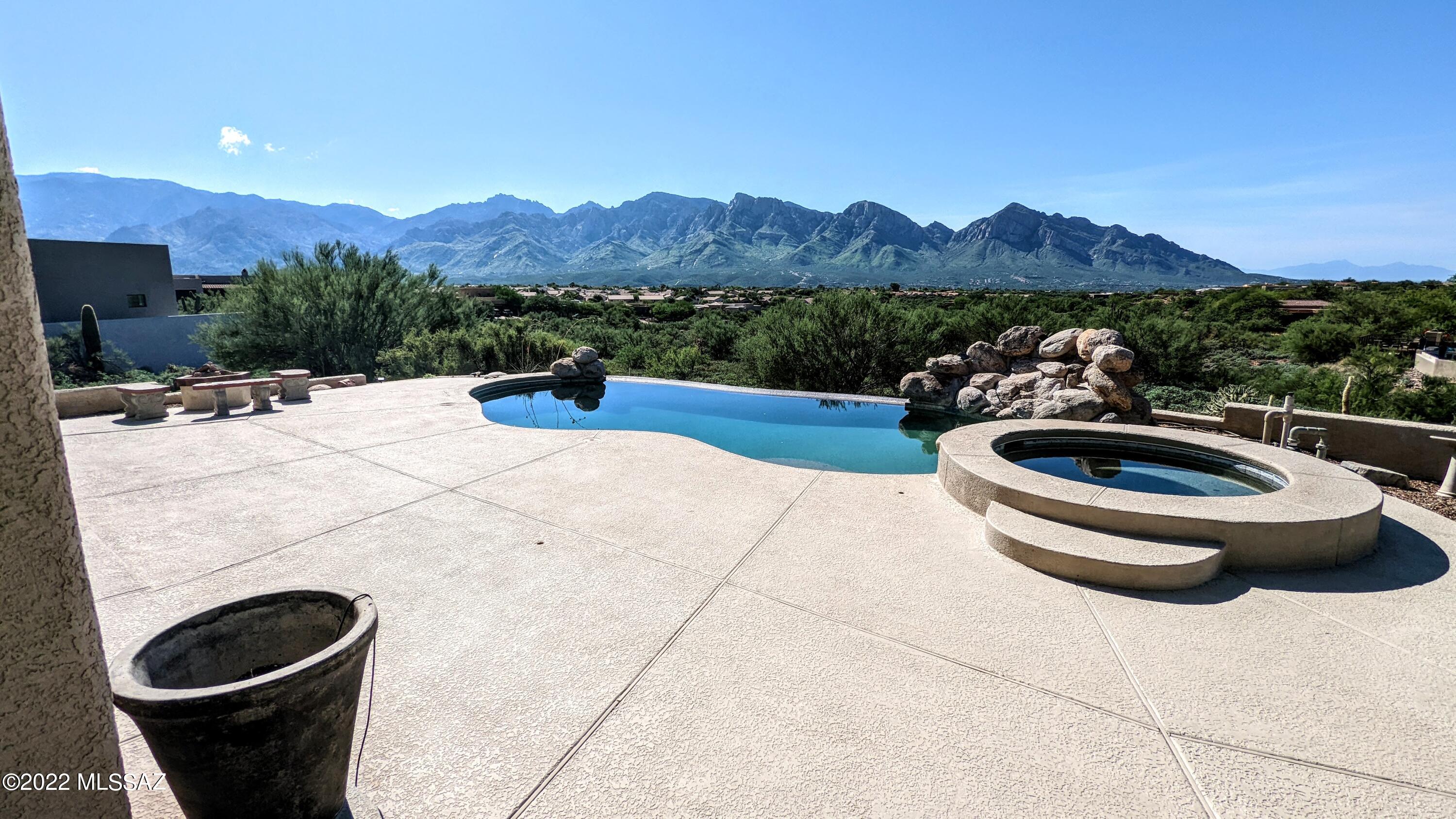 STUNNING VIEWS overlooking almost all of Oro Valley and Pusch Ridge- beautiful, uninterrupted Mountain views! infinity Pool, putting green, large covered, East-facing, rear patio, BBQ, and loads of Mature Citrus. Inside find Formal dining area and Formal living area, all opening into Spacious Great Room, Gourmet kitchen, and Views. Two guest bedrooms with baths, and Large Master Suite with adjacent Office area. Concrete floors throughout, all appliances, Laundry, 3-car garage, and more! FURNISHED home ready for you right now!  FLEXIBLE LEASE available. Are you building a new home and need a place to enjoy while waiting on yours? Want to experience the incredible Arizona/Oro Valley Lifestyle? Don't miss this one!
Contact listing brokers today!