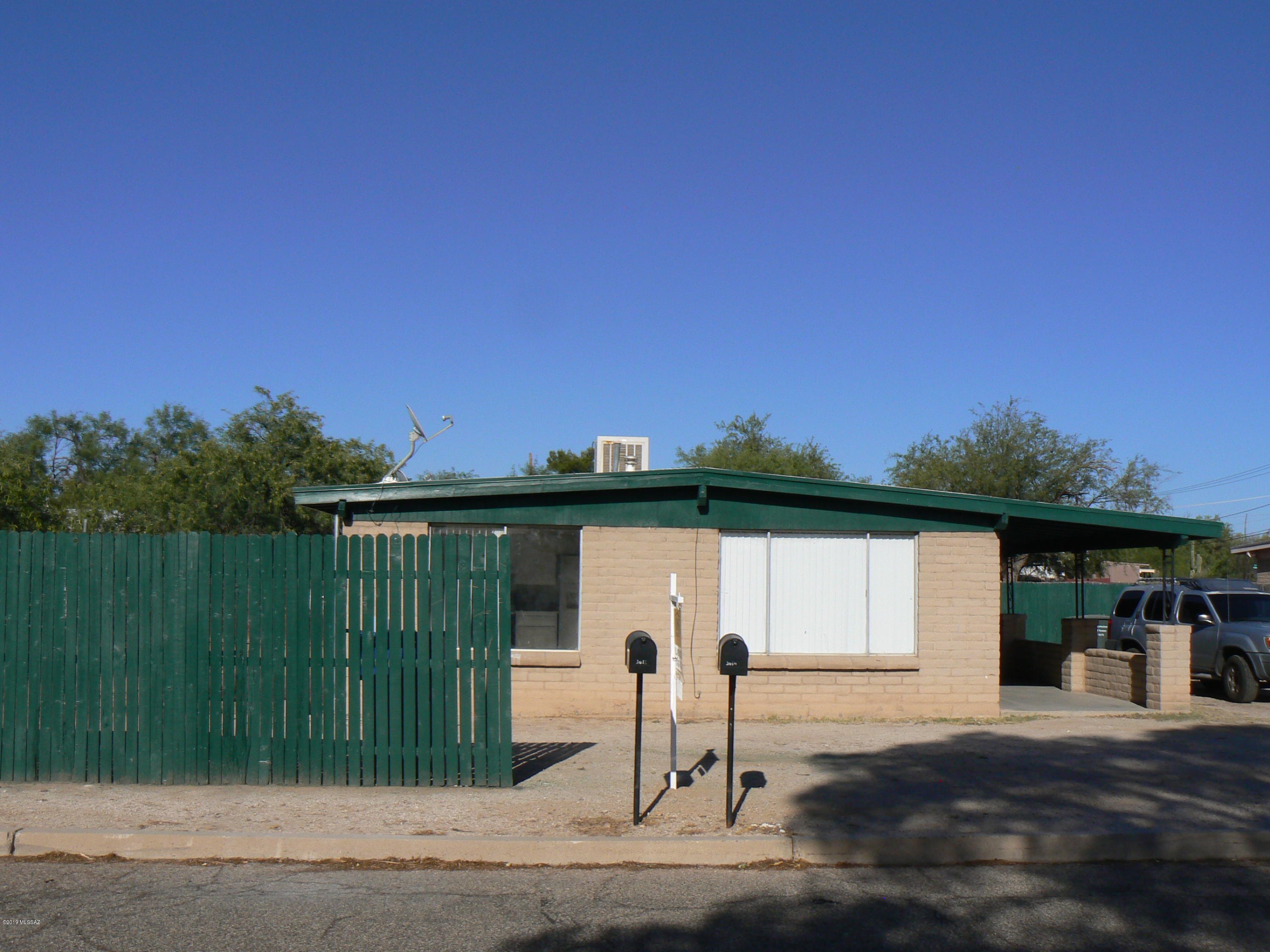 Nicely remodeled large duplex. Each unit is two bedroom, two baths (approximately 1,020 sqft.)  Both units tiled flooring throughout.  All bathrooms have tiled shower or baths with new toilets and fixtures. Freshly painted inside and outside trim. Centrally located on a quiet street. Off street parking for four or more cars. Good size yards are fenced with low maintenance plants and ample size wood decking off the kitchen entrance.