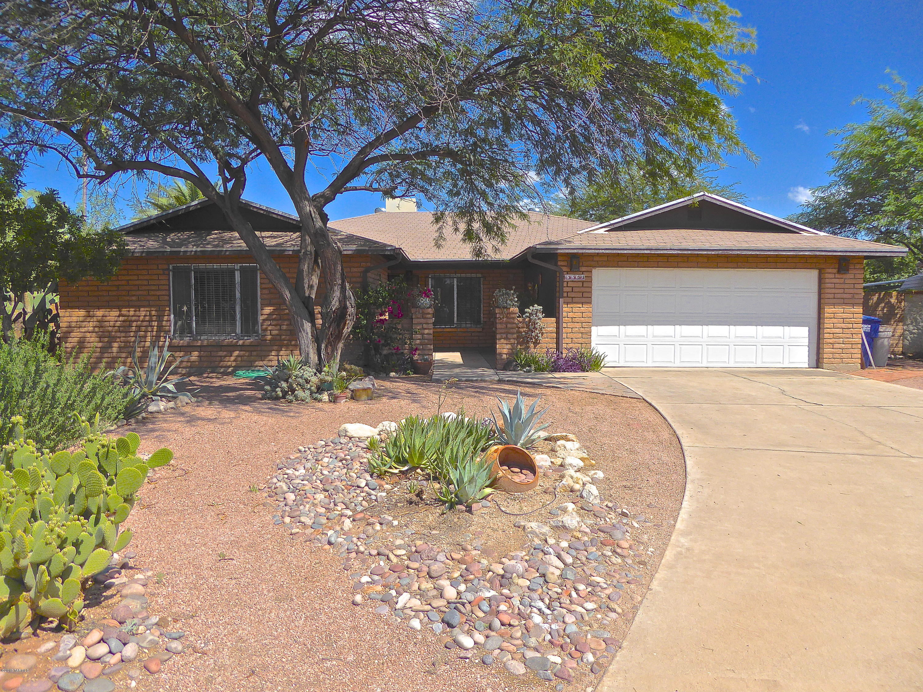 3BR/2BA Solid Masonry Home with Pool on a large Cul-De-Sac lot in Popular Rolling Hills. Courtyard Entry, Large Family Room with Southwestern Rustic Fireplace. Saltillo Tile floors, Covered Patio overlooks shady grotto-like back yard with sparkling Pool and Spa. Fruit Trees. Drive-thru gate with alley access leads to a covered RV Ramada. Owner has lived in the home for 25 years. Quiet Location.