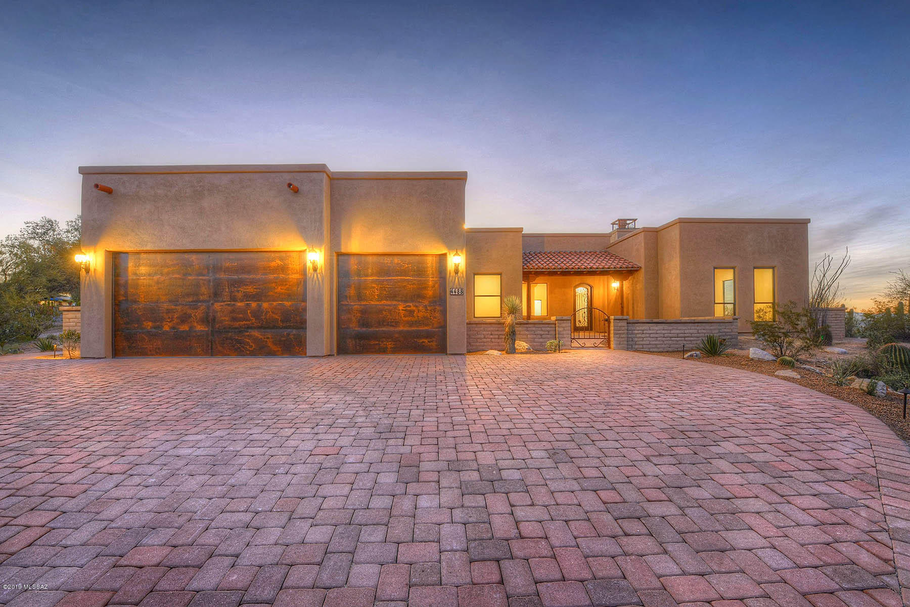 Outstanding, brand new 2019 Paul Rondelli Southwestern Contemporary high on a hill on a one acre lot in the Catalina Foothills with mountain and sweeping Tucson city views.  With 3,515 sq. ft., 4 bedrooms, soaring ceilings and views from every room, this is one you won't want to miss.  Concrete paver driveway leads to covered entry with arched wrought iron entry door, into bright open floor plan with family/living/dining/kitchen and breakfast area, fireplace and wet bar combination serving as great room, with separations for great entertaining.  Pella windows, 8' knotty alder doors, color integrated scored concrete floors, high end Danze plumbing fixtures throughout, security system and fully wired for stereo with two surround sound systems.  Chef's kitchen features rustic cherry cabinets, granite counters, stainless steel DCS appliances including 48" duel fuel range.  Gracious master suite with sweeping city views and fireplace offers bath with Cappuccino marble surrounds, dual shower heads with body spays, rain shower, walk-in shower and claw foot soaking tub.    Landscaped yards, covered rear porch, 3 car garage and so much more.