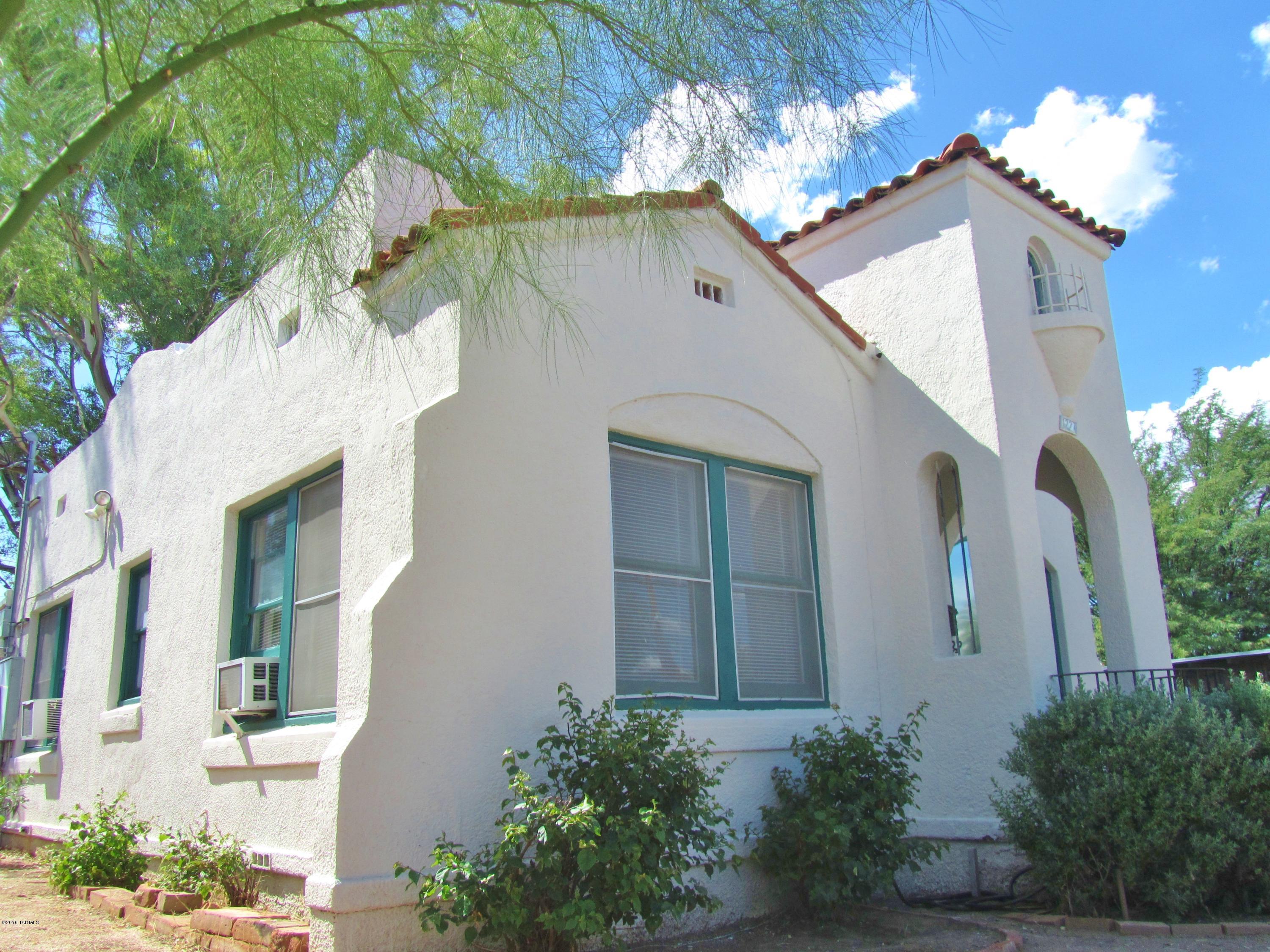 Early Spanish Colonial perfect 1st home for someone wanting style and a great neighborhood! Archways, French doors, wood floors, niches, coved ceilings, 1929 charm!  Roof just redone with 5-year warranty.  Also, AHS home warranty included.  Blenman-Elm historic neighborhood close to everything.  2 blocks to UMC, 3 blocks to the Modern Street Car, 4 blocks to UA or the Arizona Inn.  Historic property may be eligible for property tax reduction if owner occupies.