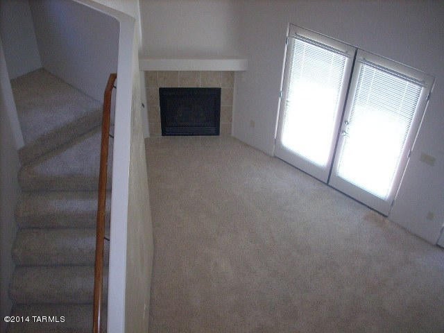 This charming and spacious home awaits you.  Beautifully painted interior, cherry cabinets, granite counter tops and a cozy fireplace are just some of the wonderful features of this home.  The master suite is large and features a balcony for great mountain views.  The court yard and community have been well maintained and being centrally located you’ll have all you need within a close distance.  The refrigerator, washer, and dyer are included.  This home can be rented for 12 months or longer.