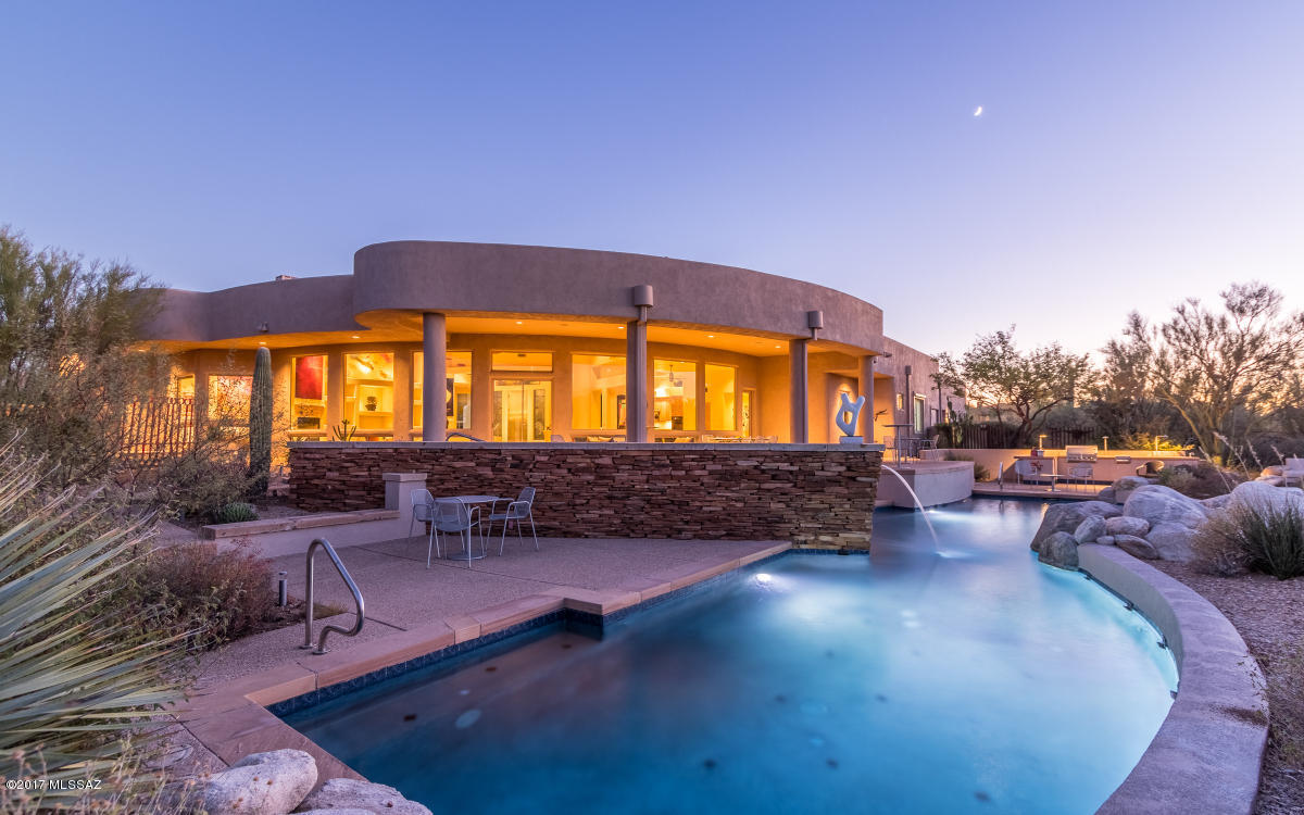 Nestled in the Tanque Verde Valley, this Sophisticated Contemporary features panoramic mtn views on 3.7 acres. Circular drive, gated ctyd w/Neoporte front door. Great rm w/fp, plank & beam ceiling & A+ views. Large Isle kitchen: granite counters, alder cabs, Dacor, Bosch & electrolux apps & mtn views! spacious MBR w/fp, spa tub, grandSophisticated Contemp. w/panoramic mtn views on 3.7 acres. Circular drive, gated ctyd w/Neoporte front door. Great rm w/fp, plank & beam ceiling & A+ views. Large Isle kitchen: granite counters, alder cabs, Dacor, Bosch & electrolux apps & mtn views! spacious MBR w/fp, spa tub, grand shower & more. 3/2 sep guest suite, BR 5: auto solar shades. spectacular htd, solar prepped, salt water pool & spa, waterfalls Over 400k invested in amenities. See attached docs