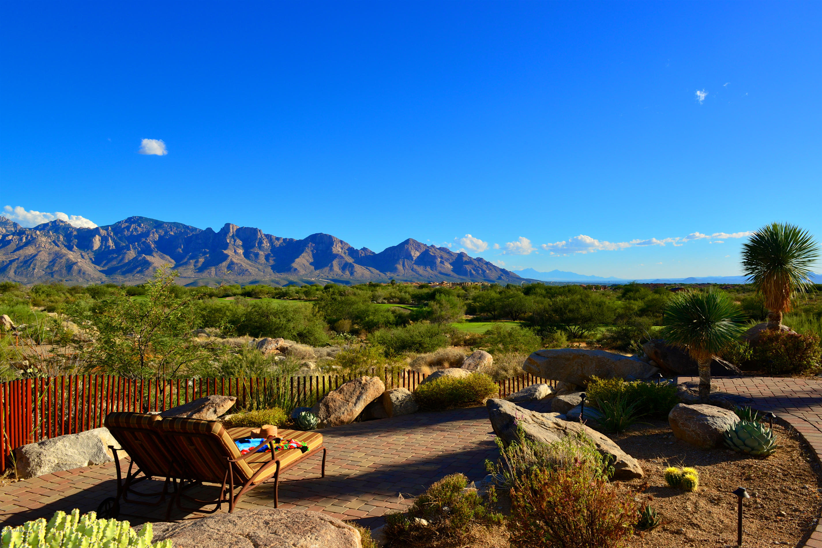 Sensational VIEWS, serenity and ambiance to soothe your senses! Impeccable AZ retreat with extensive outdoor living areas and spectacular panoramic views: east to the Catalina Mountains, south to Tucson and Mexico and west to enjoy AZ’s famed sunsets. This stunning 2,680 SF luxury residence with 3BD, 4BA, Den & 3-Car Garage offers timeless Great Room design for easy entertaining & a relaxing lifestyle. The almost 1 acre elevated site offers amazing views over the fairway below to the distant lights of Tucson. Designed by Architect Barry Berkus & built with superior craftsmanship, this well-appointed split-layout home in Phil Mickelson’s exclusive guard-gated Stone Canyon Club in Oro Valley is a perfect annual or seasonal retreat & can be acquired virtually turnkey for $894,000!