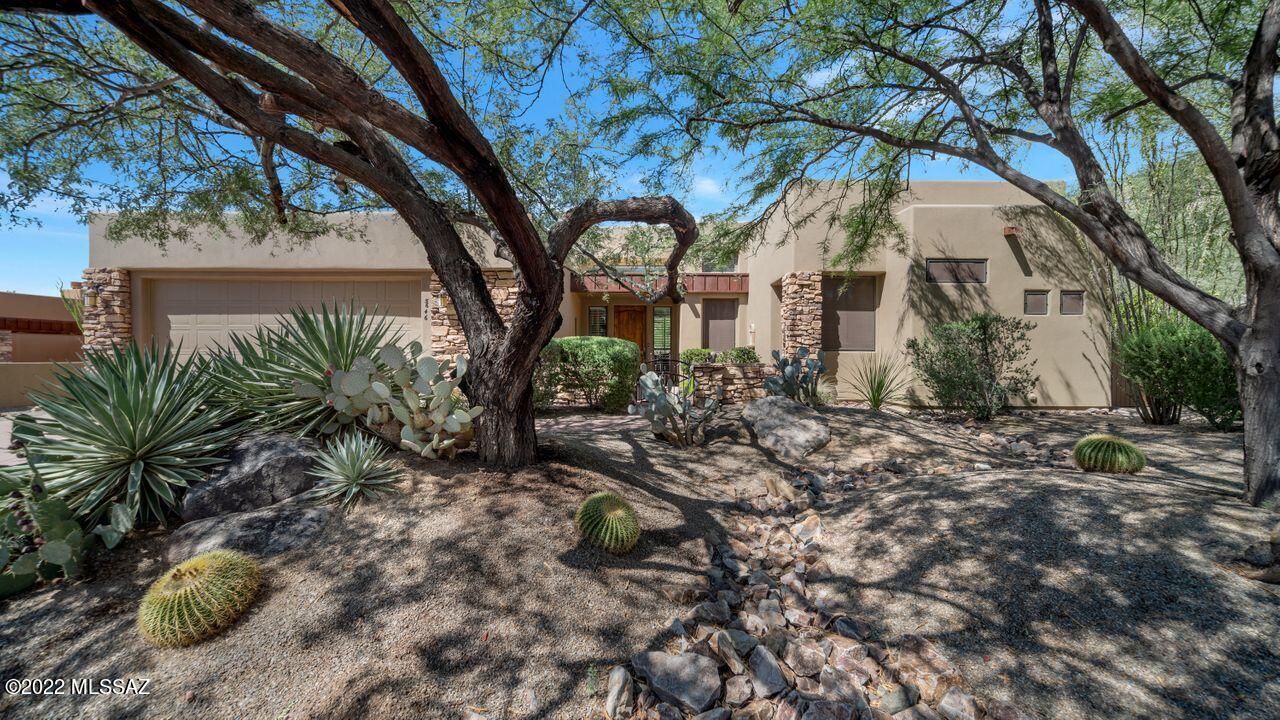 Golf villa in gated Solana, Dove Mountain !  This private end unit on 1/3 acre offers beautiful mtn views & a sparkling pool through picture windows. Special features include: hardwood floors/tile & new carpet in guest BR, plantation shutters thru-out. Custom ironwork, Spacious patio offers misters, built-in BBQ. Laundry room sink, garage storage cabs, citrus trees. Primary Suite w/ walk-in shower & dual sinks. Adjacent room is currently an office w/full bath but can serve as a den/BR.  Split plan offers 2nd bdrm w/full bath & powder room. Great room plus formal dining & media room or potential, library/office. Kit has hickory cabs, granite counters & breakfast nook. HOA includes: front landscaping, pest control, trash, gated entrance & all common area landscaping. Call for private showing