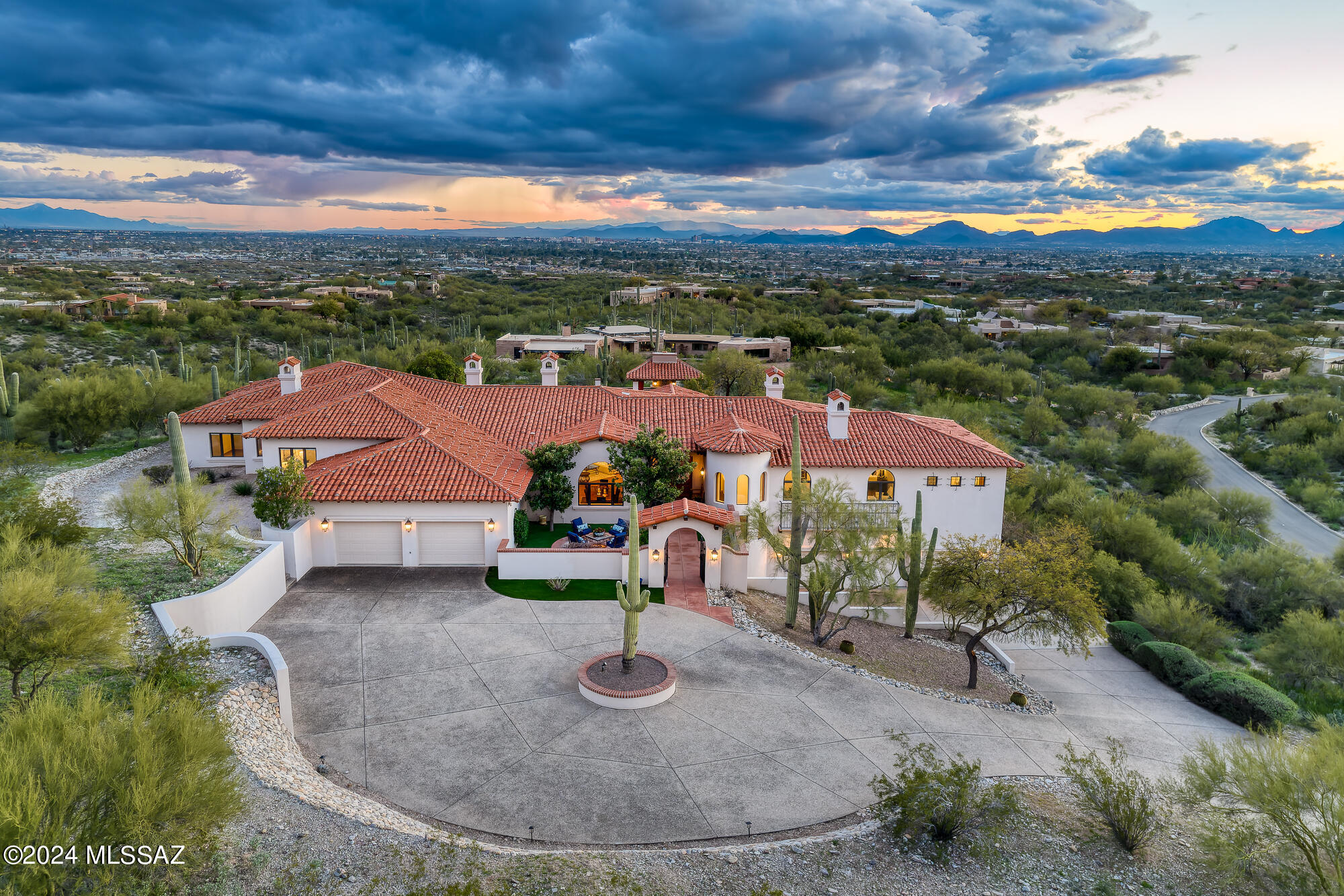 Step into a world of timeless sophistication and refined elegance, nestled within the prestigious small gated community of La Puerta, where this exquisite Santa Barbara-style estate awaits. Crafted by renowned builder Michael Wachs, this residence stands as a testament to unparalleled craftsmanship, complemented by its distinctive Mission tile roof and notable masonry construction.

Perched atop a sprawling hilltop lot spanning on 2.192 acres, this home offers unrivaled privacy and breathtaking 360 degree panoramic city and mountain views. Enjoy the serenity of your own private paradise, complete with a sparkling pool and spa overlooking the stunning city vistas that stretch as far as the eye can see.

The interiors boast expansive living spaces that provide ample room for both relaxation and entertainment. Interior features include: formal living and dining rooms, gourmet kitchen with an enclosed outdoor bbq and dining area, a family room, library, study/office, and private guest quarters. There are 4 gracious bedrooms, each with en-suite bathrooms and walk-in closets.  Indulge in the warmth of six inviting fireplaces, while rich wood floors and beamed ceilings add timeless charm and character throughout. The 5-car garage with generous storage space ensures convenience and security for your vehicles and belongings.

Welcome to your own private sanctuary, where every moment is infused with beauty, elegance, and refinement.  School district 16.

Schedule your private viewing today!