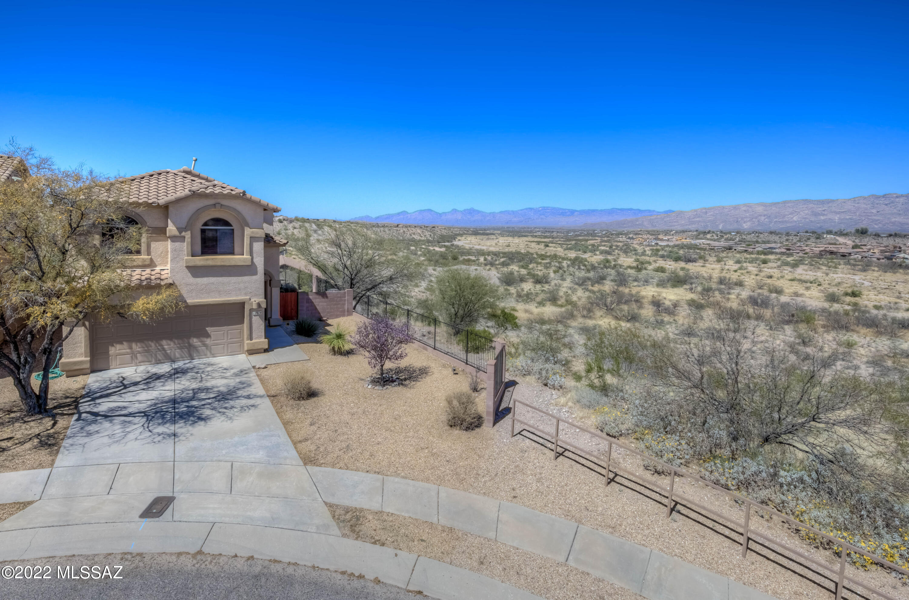 Welcome to this beautiful Rancho Del Lago home on a cul-de-sac lot with STUNNING VIEWS!! Featuring 1,904 sq.ft., 3 Bedrooms PLUS a Loft, 2 full Bathrooms with a Powder Room downstairs, a Living Room with soaring ceilings and a cozy Family Room off of the Kitchen, this home is sure to exceed your expectations!  The Kitchen boasts of granite counter tops, island/breakfast bar, and black appliances including the refrigerator! The Primary Bedroom with en suite bathroom features 2 closets, dual vanity and walk-in shower.  New A/C in 2019! Venture out back to experience the EXPANSIVE MOUNTAIN VIEWS from the private covered patio or extended paver seating area, overlooking the Pantano Wash.  Close to shopping, dining, schools and recreation, the location is unbeatable!  Schedule your tour today!