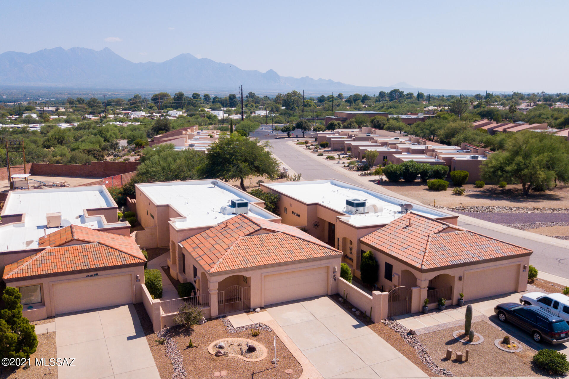 In Las Campanas ''the Heart Of Green Valley'', with Mountain Views,  enter through the nicely landscaped gated courtyard to this1700+ sf home, w/ 2 spacious master suites, large walk-in closets and private baths. Other features include a nice size kitchen open to a separate dining room, and a spacious living room w/ large windows and doors for natural light.  Enjoy the private serene backyard w/ extended brick patio, waterfall and breathtaking panoramic views of the Santa Rita Mountains. Green Valley Amenities galore- golf courses, clubhouse, gym and community pools.  Live the life in this wonderful Las Campanas neighborhood in Green Valley.