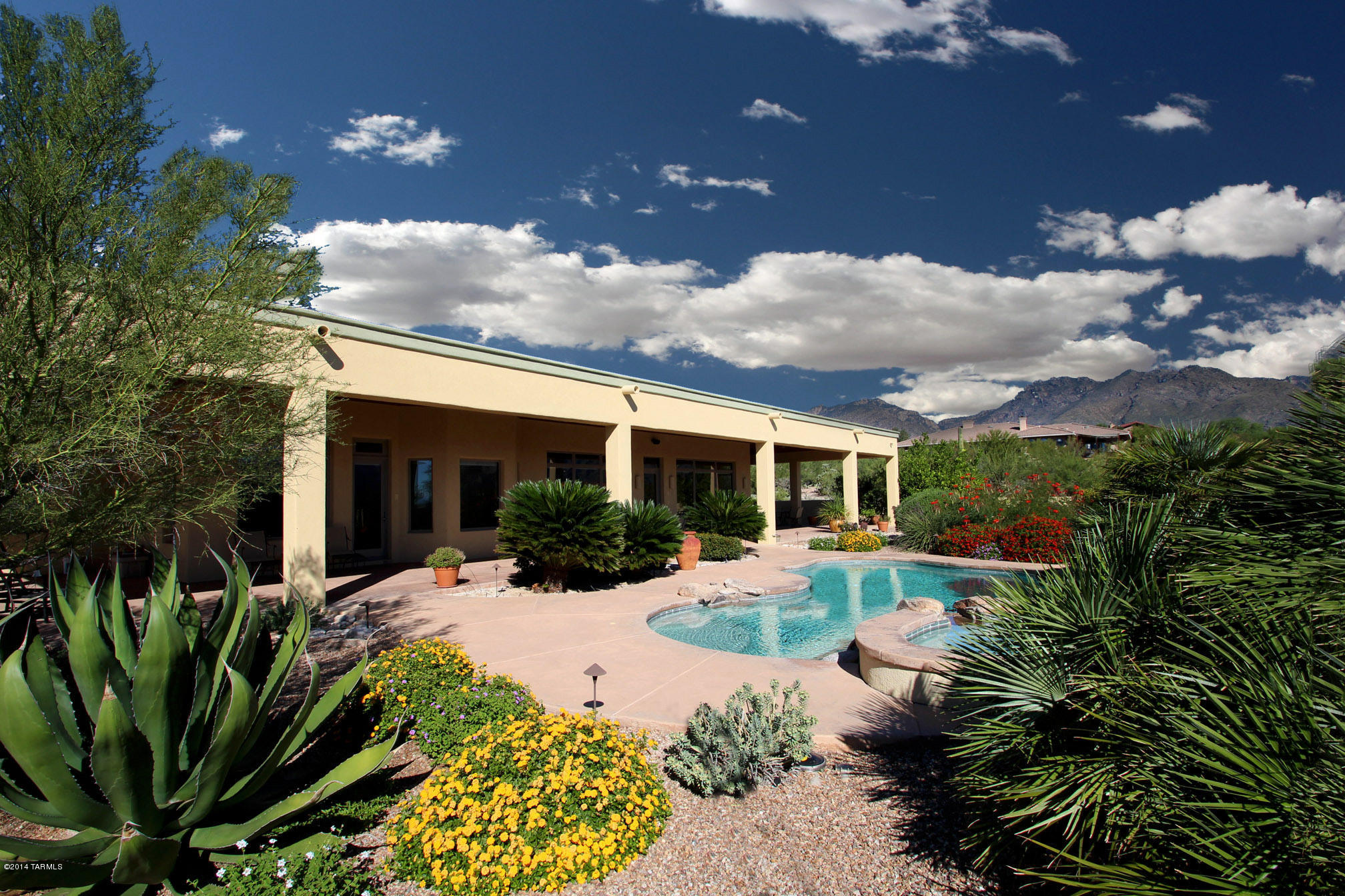 BREATH TAKING RIDGE TOP VIEWS-Panoramic Mountain, Sunrise, Valley + Sunset Vistas. Perfection inside and out_Custom Built to the seller's exacting specifications by renown builder, Charles Lathrem. Exquisite Finishes-8Foot Aler Doors created by Butler Doors with brass hardware-Natural Stone Floors-Anderson Energy Efficient Windows-Cherry Cabinets and Drawers-Grohe Faucets-Toto Toilets-Fabulous Lighting-Quality Appliances-Extra Deep and Wide 3 Car Garage has Cabinets and EZ Clear Floor-Adjacent is 20x20 Workshop or Exercise Room with Mini-Split-Beautiful Master Suite w/Luxurious Bath+One of the Best Closets in Tucson! Huge Office(4th BR) and Den-Split Bedroom Plan-Glorious Grounds-Delightful Pool/Spa/Waterfall-Huge Covered Porches-Perfect for Entertaining!Beautifully Built and Maintained!!