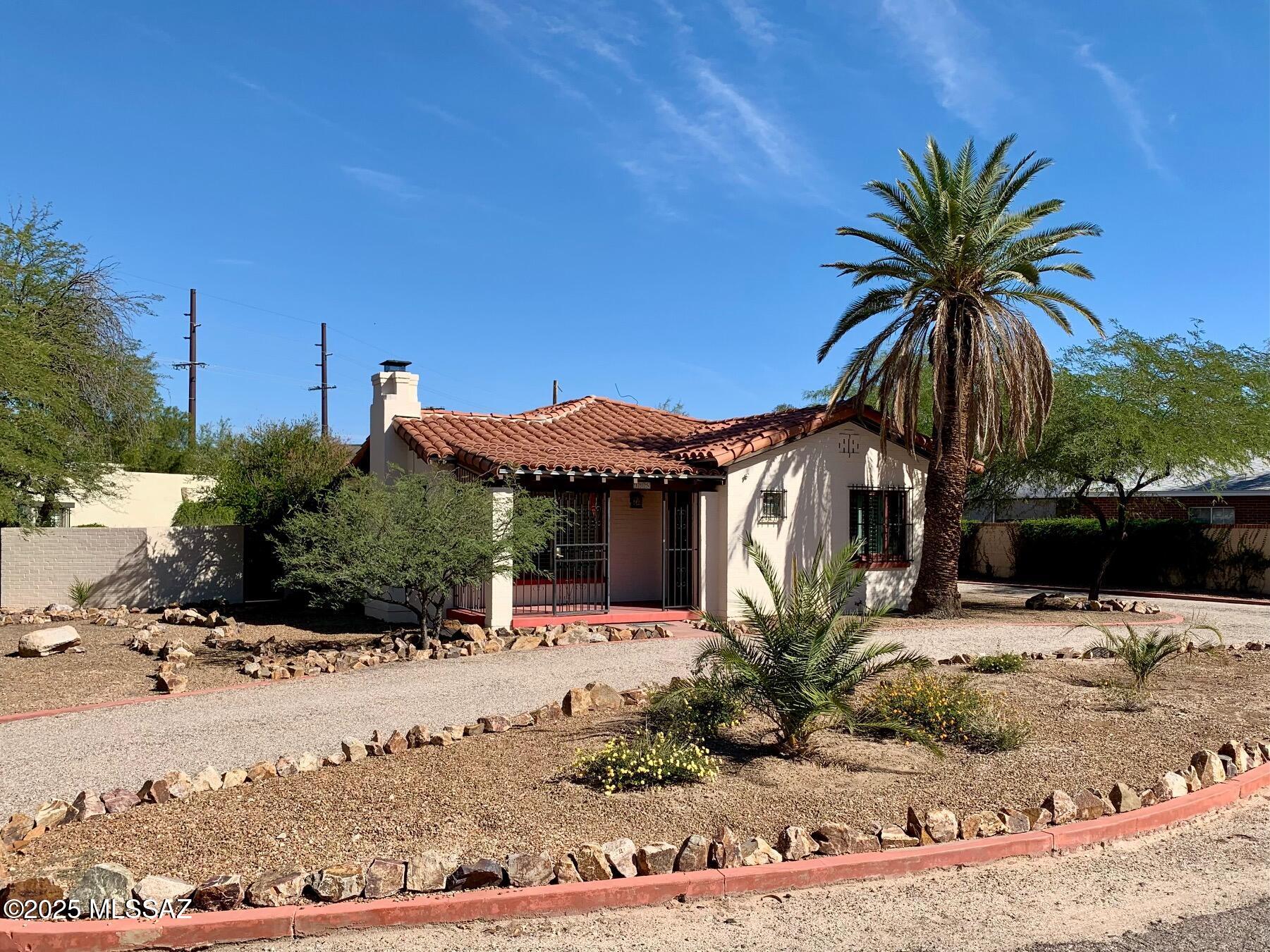 This is your opportunity to own a centrally located Historic home with guest quarters in the coveted San Clemente neighborhood. Main house is a 1,520 sq. ft. 3 bed/2 bath with hardwood floors and Saltillo tile.  Window blinds throughout.  Pella French doors in two bedrooms. Water heater installed 2022. Plumbing re-pipe of home in 2019. The 440 sq. ft. detached guest quarters with  roof replaced in May of 2026 can be a rental or a place for the in-laws. Full kitchen and bathroom. Ceiling fans throughout. Mini split  installed 2023 . Wrought iron security on doors and windows throughout property. Main sewer line from main house to street replaced  2021. Historical tax status for potential reduction in property taxes. Mature landscaping. Convenient to Downtown, UofA ,restaurants and shoppin