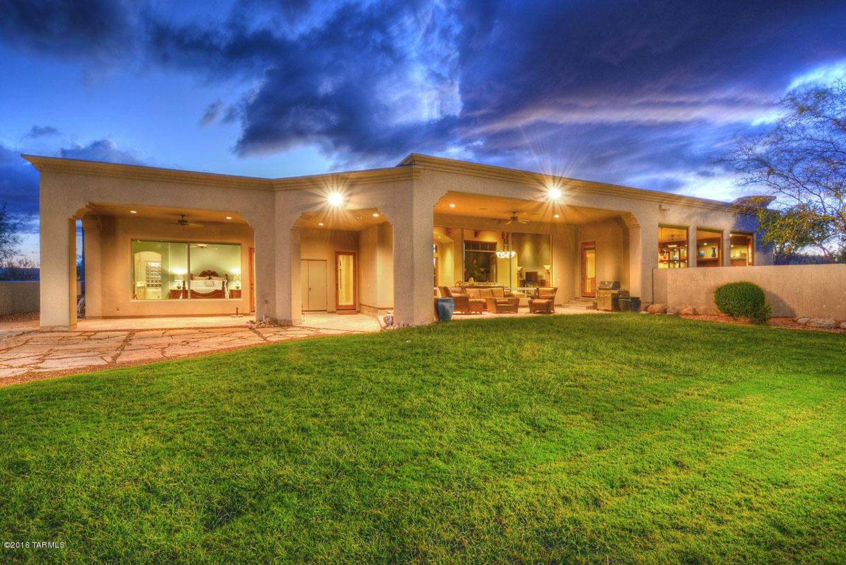 EXQUISITE SOFT CONTEMPORARY W/BREATHTAKING MT. VIEWS IN PRESTIGIOUS GATED PIMA CANYON ESTATES. FRONT COURTYARD ENTRY, ELEGANT LIVING ROOM AND DINING ROOM W/DRAMATIC HIGH CEILINGS, WALLS OF WINDOWS, GOURMET ISLAND KITCHEN W/GRANITE COUNTERTOPS, STAINLESS STEEL APPLIANCES, GAS STOVE TOP, LOVELY BREAKFAST AREA OPEN TO FAMILY ROOM WITH BEAUTIFUL FIREPLACE,  GORGEOUS TRAVERTINE FLOORS, FRENCH DOORS, 4 BEDROOMS (SPLIT PLAN) INCLUDING SENSATIONAL MASTER SUITE W/SITTING AREA, LUXURIOUS  BATH W/ JACUZZI  TUB, WONDERFUL SHOWER, LARGE WALK IN CLOSET ,LAUNDRY ROOM AND 3 CAR GARAGE. FABULOUS BACKYARD W/COVERED PATIO, GRASS, LUSH LANDSCAPING AND MAJESTIC MT. VIEWS.
SEE FLOOR PLAN UNDER PHOTOS, THEN VIRTUAL TOUR.