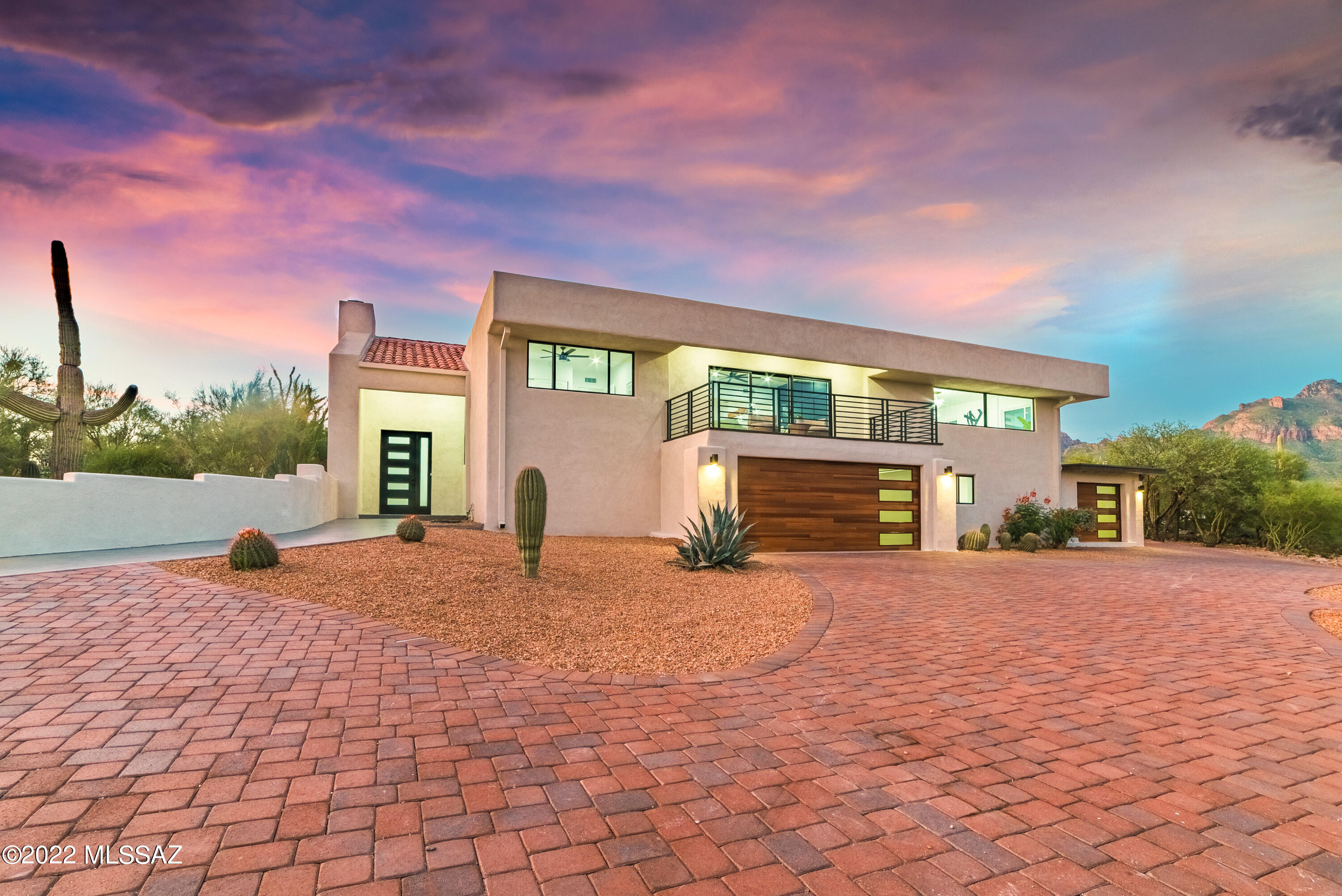 Located in the highly coveted Santa Catalina Estates, this is one of the most magnificent homes in the Catalina Foothills and first time available since the original owner. With four bedrooms, three and a half bathrooms and over 4,000 square feet of exceptional living space. Everything about the expansive floor plan from the jaw dropping gourmet kitchen to the exquisite master retreat showcases great taste, and custom elements that enrich each and every space. Not a detail was overlooked from the exterior modern touch and brand new pool to the interior quality that features new dual HVAC systems, new luxury vinyl plank flooring, gorgeous exposed trusses, new kitchen cabinets, quartzite counter tops, 48'' commercial grade range, new double pane windows throughout, tiled fireplace, and all new recessed lighting. Adding to its attraction, it's perfectly positioned on close to an acre with exceptional mountain and city views. You'll also find a spacious 3 car garage with workshop, patio deck, and an immense amount of room for entertaining. All of this located close to top rated schools, shopping and more. Owner/Agent