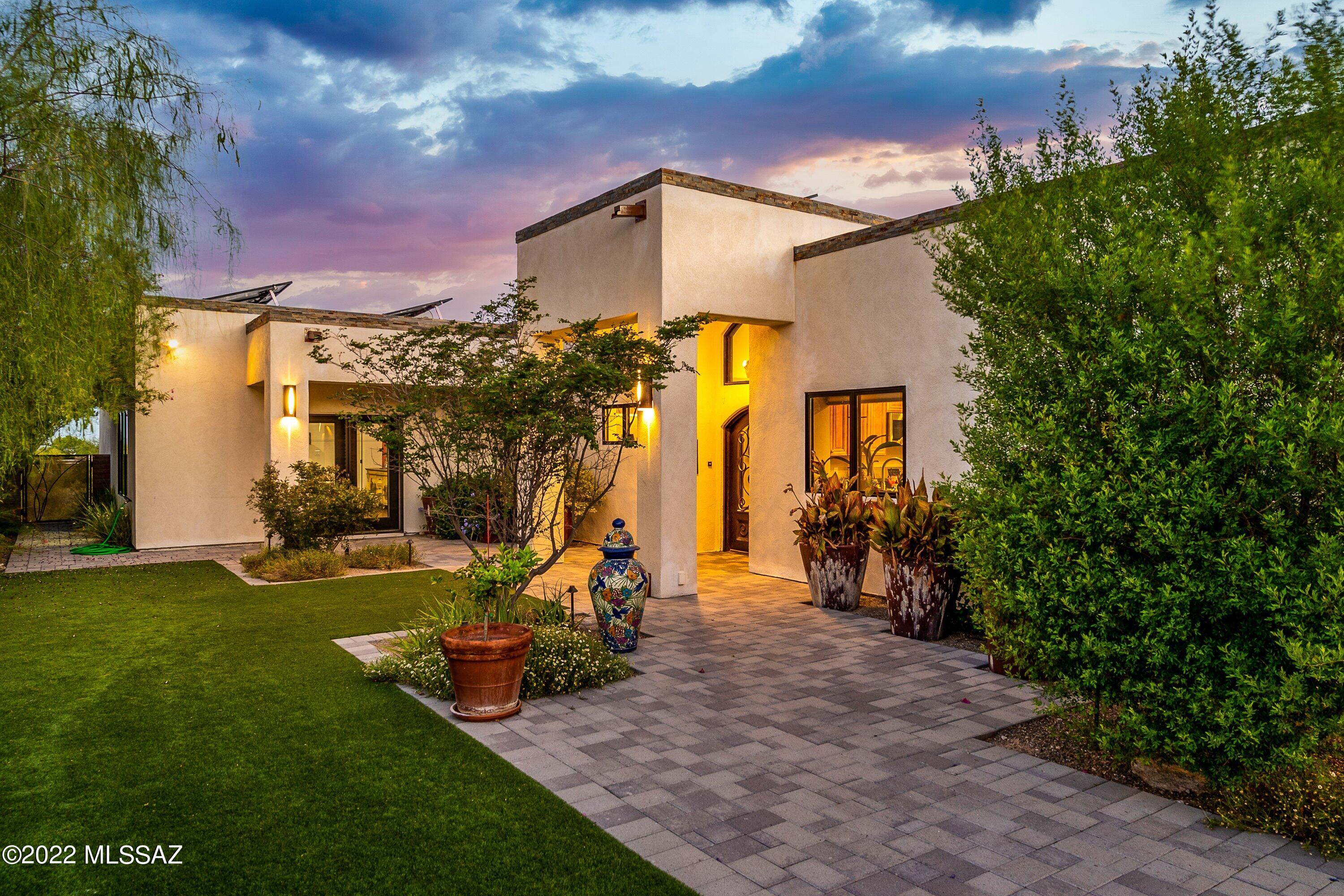 Welcome to this truly spectacular Tucson home! Situated on over 1 acre in one of Tucson's most desirable neighborhoods, Catalina Foothills Estates NO 5, this contemporary style home boasts mountain views, resort style backyard with sparkling pool & jacuzzi, raised ceiling grand entry, travertine & wood floors, oversized new windows, spectacular laundry room with doggie door to dog run, private courtyard entry, 3 car garage with storage closet and solar.  The exquisite master suite boasts private office/den, large walk-in closet, and new ensuite bath with private outdoor shower. The spacious 2nd and 3rd bedrooms offer ensuite baths along with direct access to the backyard & gorgeous views.  Owners made all upgrades for themselves and no attention to detail was spared. Don't miss this!
