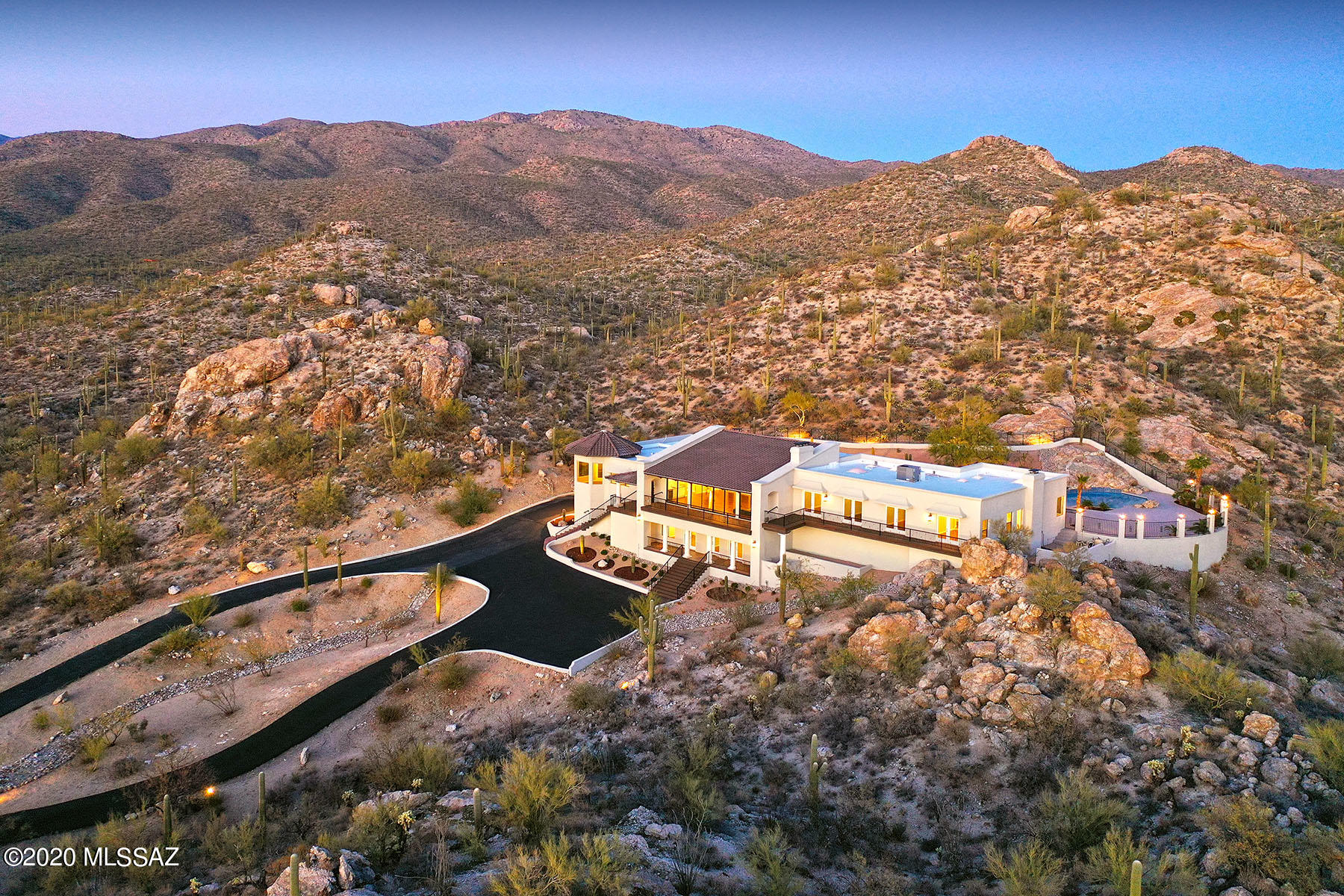 Panoramic views of mtn, city & the Tanque Verde valley beckon through walls of windows adorning this luxurious home beautifully set on 7.22 acres of a hillside.  Gleaming pecan wd floors, etched marble FP, fabulous ALL NEW KITCHEN incl 48-inch dual fuel range, double ovens, 2 DW, separate column refrigerator/freezer, oversized island w/bar seating, solid wood cabinets & casual dining w/jaw-dropping views. All new baths; split plan offers romantic owner's suite w/FP, city lights & a ''wow'' spa-like bath w/soaking tub & pool access; the  lower level is great entertaining or kid hang-out space w/exercise rm, wet bar, potential media room.ALL NEW MECHANICALS + 6 dramatic fp's, sweeping view terraces, artisan-crafted iron work & outdoor living/dining rm!WOW Owner is a licensed Ariz. RE agent.