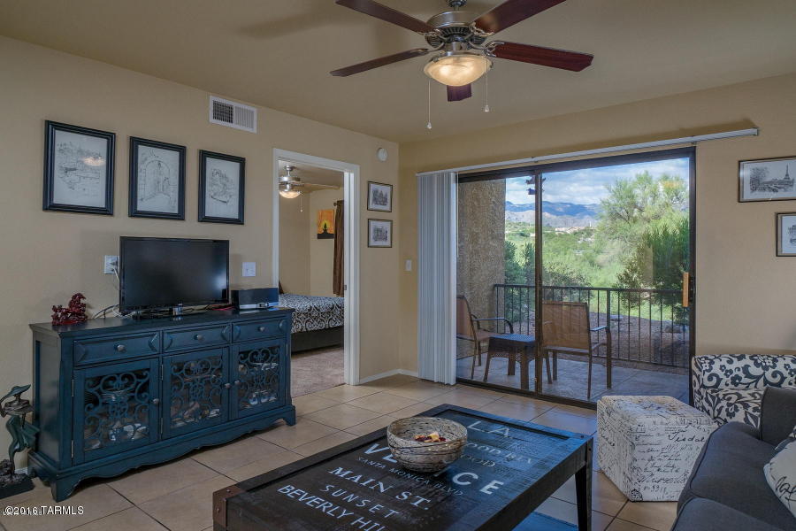 Private renovated ground floor condo with amazing Catalina Mountain view in the gated Northern Tucson community of The Villas At Sabino Canyon. This spacious Catalina Foothills condo features ceramic tile flooring everywhere except bedrooms, East facing covered patio with breathtaking views, split bedrooms, romantic wood burning fireplace, kitchen with custom cabinets, granite counters and stainless steel appliances, ceiling fans in both bedrooms and resort style amenities. The Villas At Sabino Canyon include a heated pool & spa, exercise facility, park-like grounds and a convenient location near shopping, restaurants and Sabino Canyon Park.