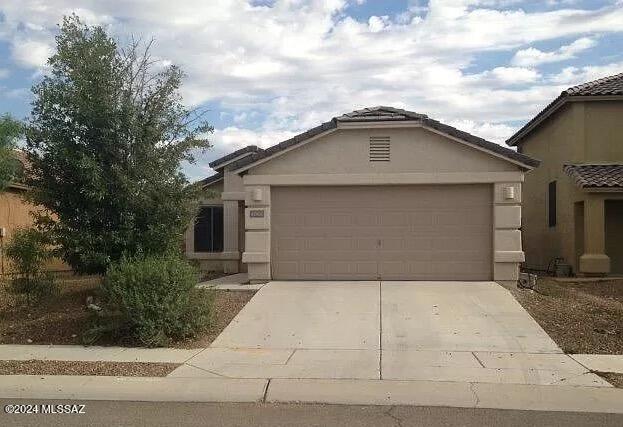 This charming 3-bedroom, 2-bath home is located in Tucson's highly desirable Valencia Reserve neighborhood! From the welcoming and open entryway, you'll find a beautifully designed kitchen featuring all appliances, maple wood cabinetry, ample countertop space, and an abundance of natural light. There is a separate dining area and the spacious formal living area and great room provide plenty of living and entertainment space. Tile flooring is in all the right places, complemented by beautiful arched doorways. The generously sized carpeted bedrooms each include plush carpeting and ample closet space. Ceiling fans are thoughtfully placed throughout the home. The two full baths are well-appointed, and the inside laundry room includes overhead storage shelving.