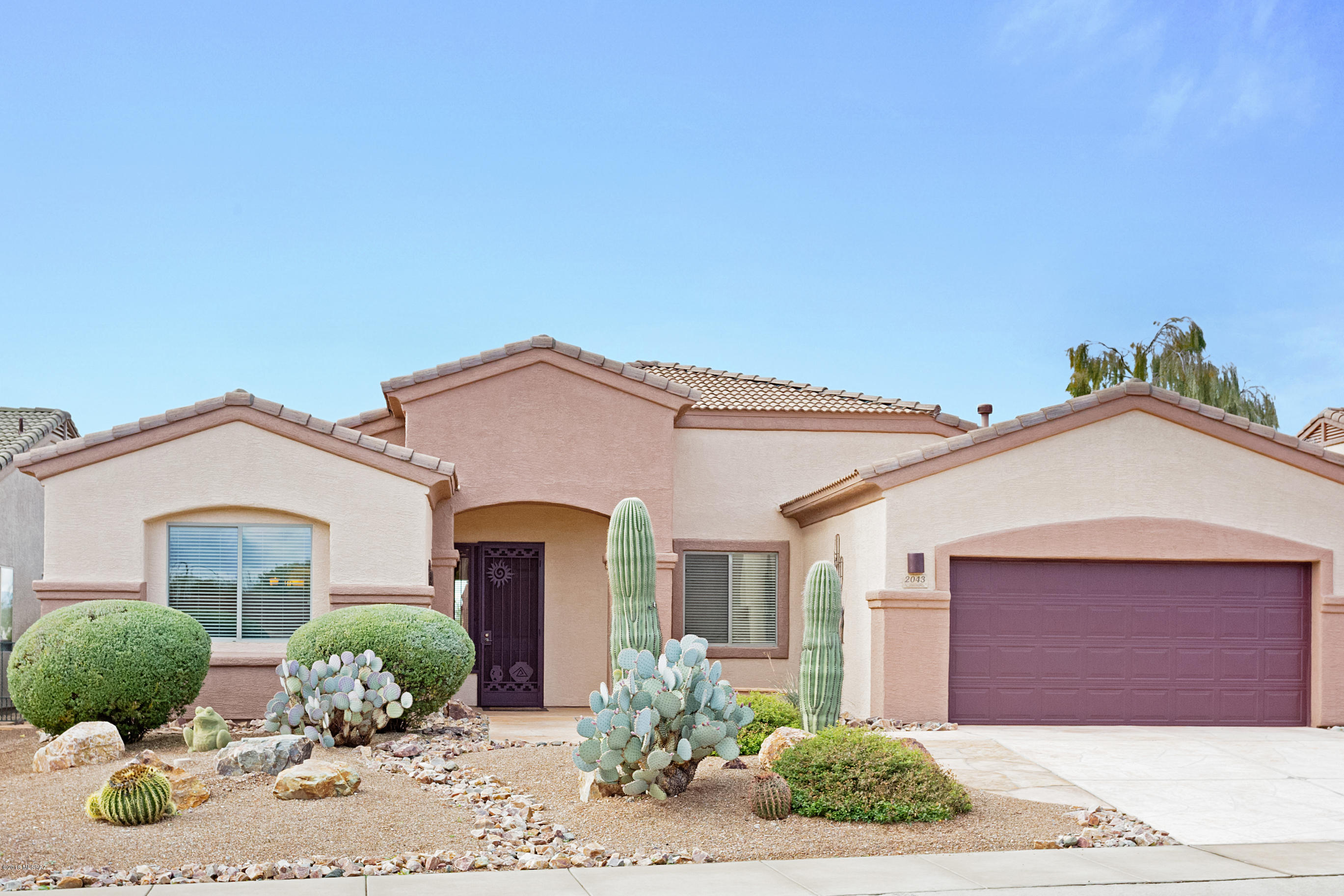 Quality exudes from this highly updated Redington floorplan.  New HVAC 10/18, new dark cherry kitchen cabinets w/pull-outs and soft-close 12/18, ext. paint 6/18. Lots of upgrades in 2015: lighting, ceiling fans, carpet, granite, all new kitchen appliances. Cozy up to the tumbled travertine fireplace this winter. The office is spacious and the formal rooms could be used as a den/hobby area. The spacious master bedroom has room for a reading area or extra furniture with doors to patio. Both bathrooms have executive height counters and new 'comfort height' toilets. Laundry room has deep sink, plenty of cabinets and granite counters. Entertain at your built-in BBQ. Patio has pull-down sun shades for those great sunny days.  Step out to the patio by the wall for great mountain and sunset views.