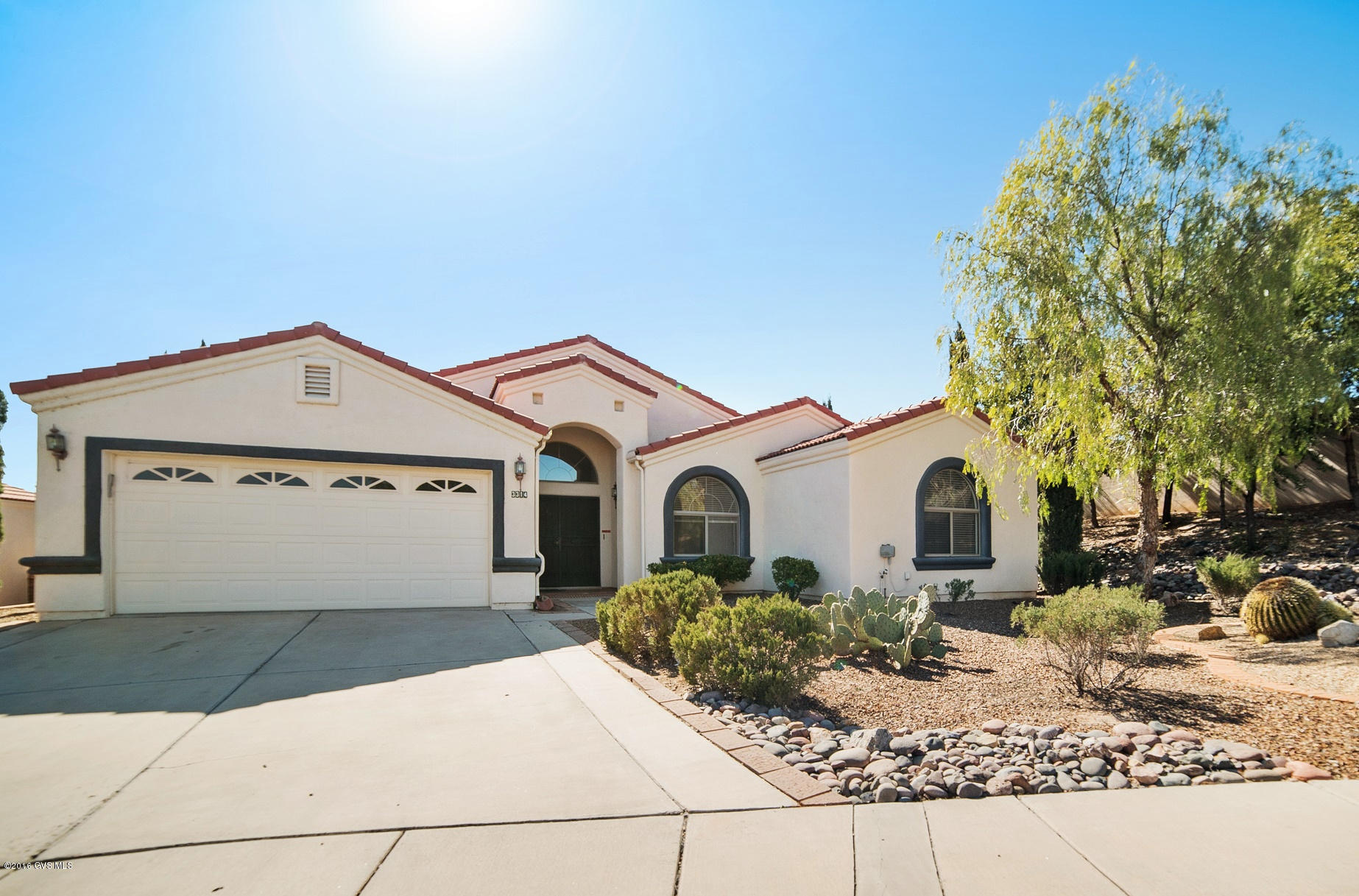 Wonderful curb appeal with cascading roof lines, archtop windows and a grand double door entry welcome you to this newly updated home in the gated community of The Greens. You'll enter into a large great room with vaulted height ceilings, an open dining area and a corner gas fireplace. The kitchen features a prep-cook island, crisp white countertops, hardwood cabinetry and has a convenient breakfast nook with sliding door to the large covered patio. With 1910 square feet, and 3 bedrooms it offers plenty of flexibility for the use of the rooms. Enjoy your time relaxing on the shady patio or in the refreshing water of your private pool!
