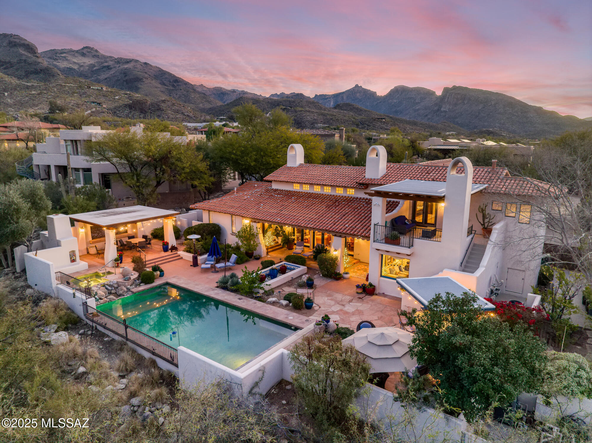 Character, Warmth, & Charm, Exude in This 4 Bedroom & 4 Bathroom  3800 SqFt Custom Spanish Mission Style Home on the Golf Course in The Prestigious Community of Ventana Canyon.  Some of This Homes Fine Features Include: Courtyard Entry w/ Lush Vegetation & Artwork - Formal Living & Dining Room w/ Vaulted Wood Beamed Ceilings & Grand Fireplace - Eat In, Island Kitchen w/ Stainless Appliances, Gas Range, & Secretary Desk Opening to Great Room w/ Custom Cabinetry & Fireplace - Split Bedroom Plan Offering Primary Suite w/ Balcony on One End & 3 Guest Rooms on The Other + Office - 3 Bay Motor Court - Spacious & Private Rear Outdoor Living Area w/ Covered Patio, Water Feature, Outdoor Kitchen, Dining Ramada w/ Fireplace, Sparkling Pool & Spa all Framed by Fantastic Golf Course & Mountain Views!