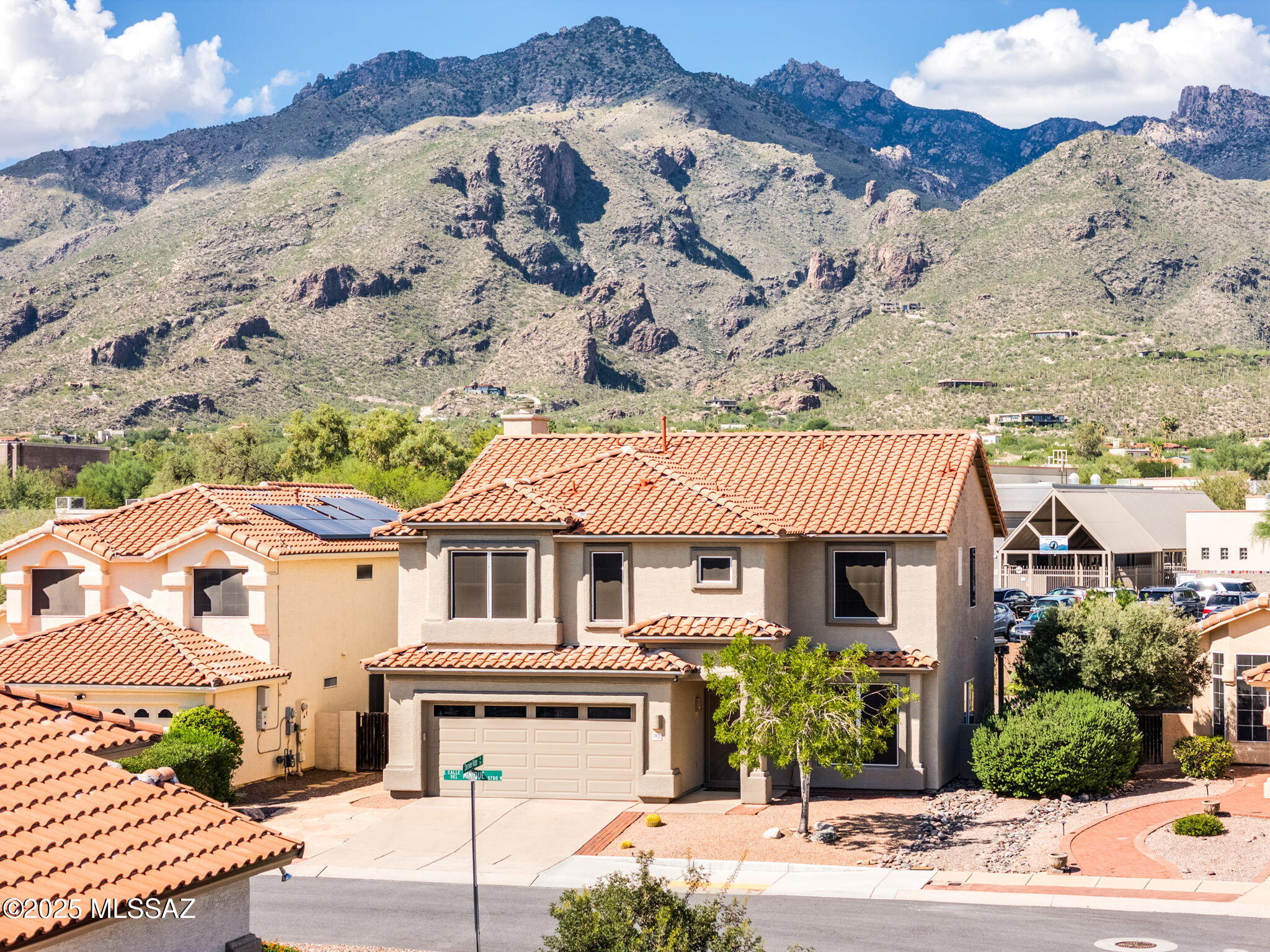 Beautifully updated 4 bed, 3 bath ,2211sqft home  in the award-winning Catalina Foothills School District. Downstairs features luxury vinyl plank flooring, a bright gourmet kitchen with quartz countertops, cabinets with pullouts, and stainless appliances, plus a great room with cozy gas fireplace and a large formal dining room. Upstairs offers 4 spacious bedrooms, including a primary suite with dual vanities, walk-in shower, soaking tub, and walk-in closet.  Enjoy spectacular mountain views, including Thimble Peak, from the large covered patio with extended paver patio, retention wall with desert plants, and low-maintenance artificial turf. Walking distance to schools and Sabino Canyon and close to shopping and dining! New roof (2024)  This well maintained home is truly a gem, call today