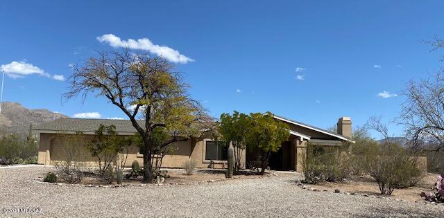 Situated on an acre+ lot in Tanque Verde Valley, this 4-bedroom/3-bath home with separate, private entry guest quarters, feels like country living with city convenience. The split bedroom plan offers spacious living areas, breakfast nook, vaulted ceilings, plant shelf and living room fireplace. French doors lead to the extended brick patio where ever changing shadows fall across the mountains. This is truly a place to call home!