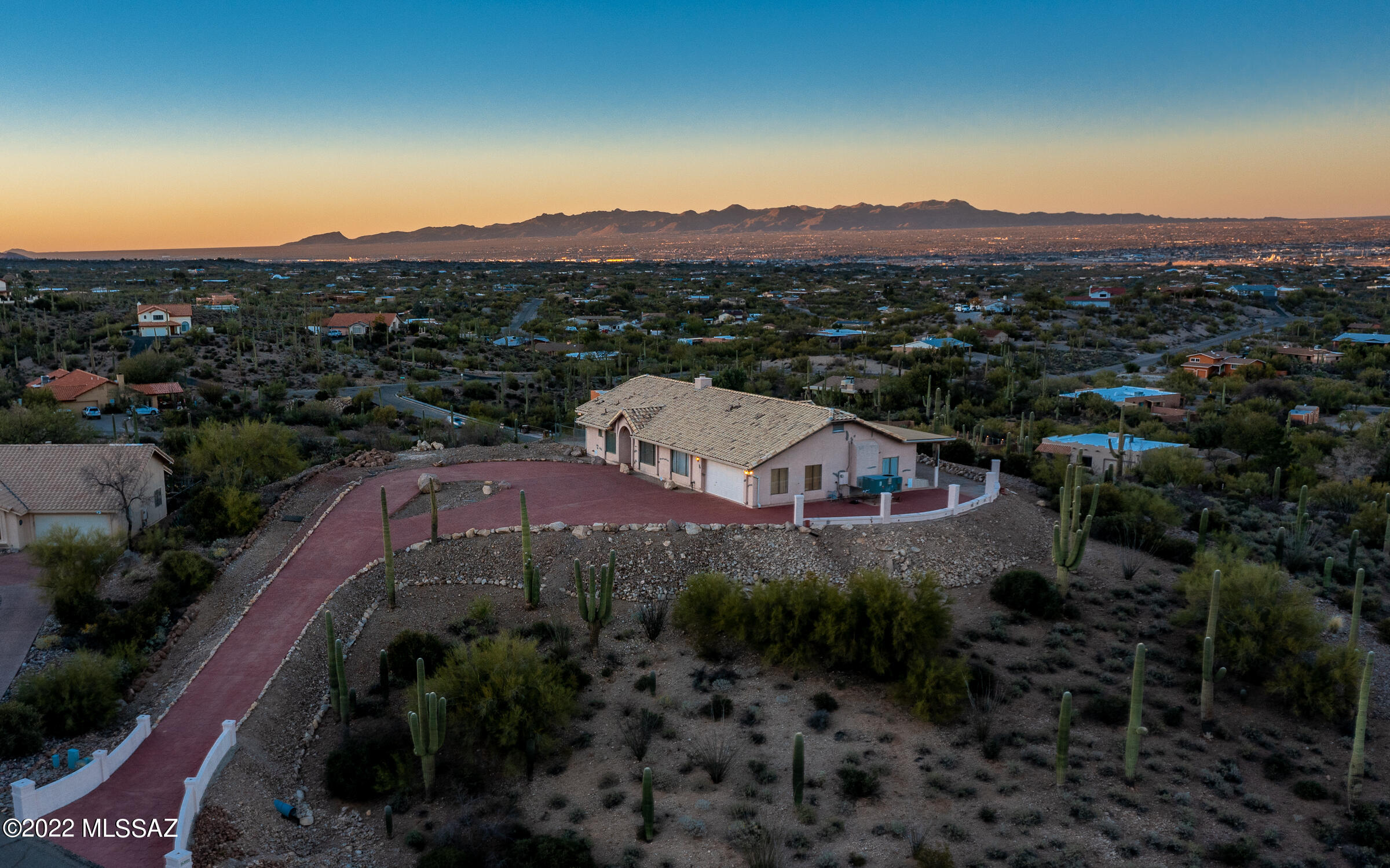 $MULTIMILLION Views at a little over HALF A MILLION! See 5 mountain ranges, several cities, and heck, all the way to Mexico. Even with pictures, it's hard to do this location justice. It's nothing less than breathtaking. Next to the Sweetwater Preserve and 4 miles from El Camino del Cerro trailheads. The neighborhood streets are being redone right now, and the drive way is solid ornamental concrete. The house features 4 Bed and 2 Bathrooms and a big additional dog or whatever room which is heated and cooled and has a closet. A dog run is also included. The house is in perfectly livable condition and can be updated either in one shot at the beginning or slwoly but surely ove time. This is one of the most unique and desireable lots I have come across in 20 years in real estate.