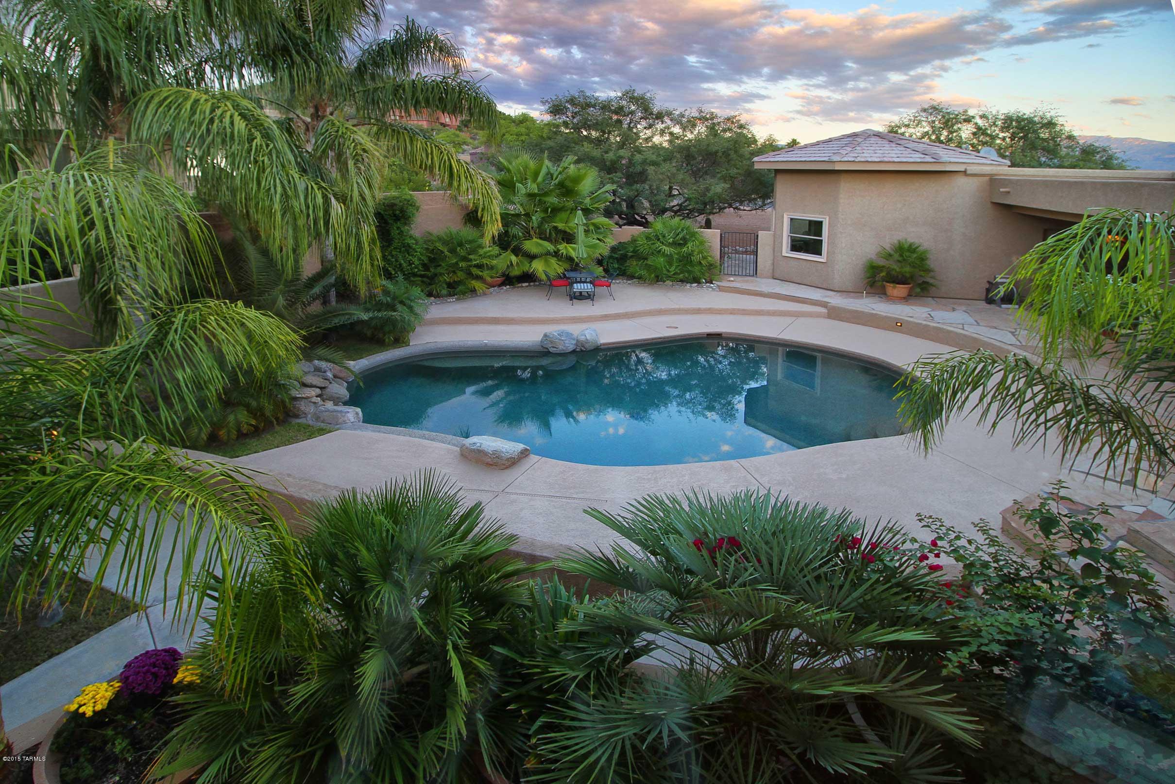 4bd/4ba, 4018 sf of luxury in a quiet, gated, small enclave of estate homes in the Foothills. Built in 2004; completely renovated inside & out in 2010 w/energy efficient windows & doors, Epicurean kitchen w/granite counters, lg island w/ many drawers, SS Bosch appliances, walk-in pantry, brkfst area & fam rm. Fabulous master suite w/fireplace, dual closets, lavish marble & granite bath, dual shower, spa tub, mini-bar, microwave, sitting area. Home refinished in superior materials. Private study off master, 4th bdrm w/ensuite bath perfect for guests or live-in. Bdrms 2& 3 w/Jack & Jill bath. Formal living & dining rms, formal foyer, travertine floors, city lgts and mtn views. X-lg 3 car garage, lush backyd w/pebble tec pool, fireplace, fruit trees. Covered flagstone patio. $825K appraisal.