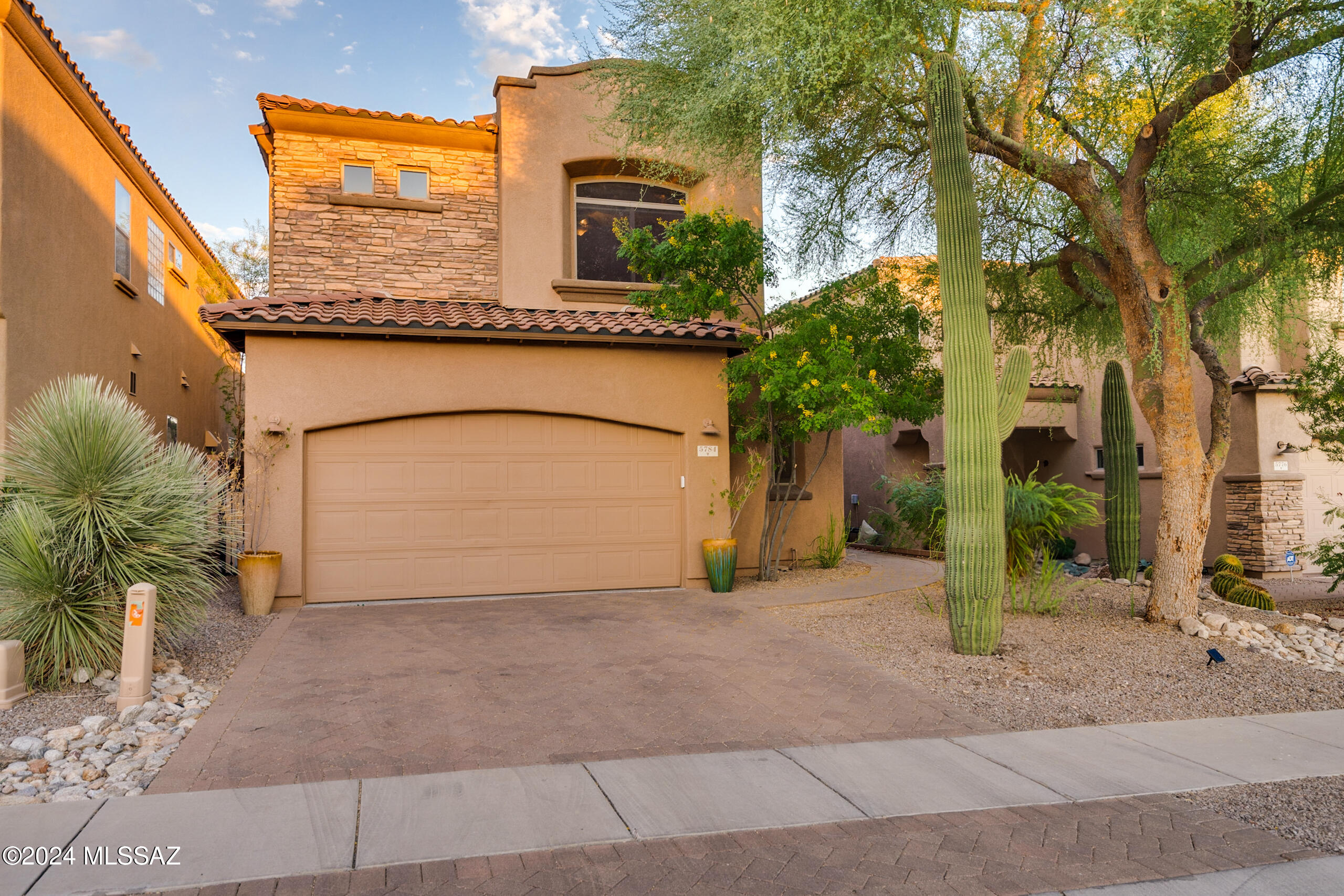 Welcome to this exceptional home located on a premium lot in the prestigious La Paloma Golf Course community, where breathtaking views of the surrounding mountains, lush fairways, and twinkling city lights await you.
This thoughtfully designed home features a rare floorplan with 3 bedrooms and 4 bathrooms, including two primary suites. One of the primary suites is conveniently located on the main level, offering two walk-in closets and direct access to the back patio. Each bedroom includes its own en suite bathroom, ensuring privacy and comfort for everyone.

The open kitchen boasts beautiful granite countertops, stainless steel appliances, and a convenient breakfast counter, perfect for casual dining or entertaining. It flows into the expansive great room with soaring ceilings and and oversized windows that flood the space with natural light, creating a bright and airy atmosphere.

Upstairs, you'll find the second primary suite, ideal for families, in-laws, or guests, along with a versatile loft area that offers the perfect space for a home office, reading nook, or secondary living area. Situated in a secure, gated community, this home combines elegance, modern living, and tranquility, right in the heart of La Paloma.  Owner is a licensed real estate professional