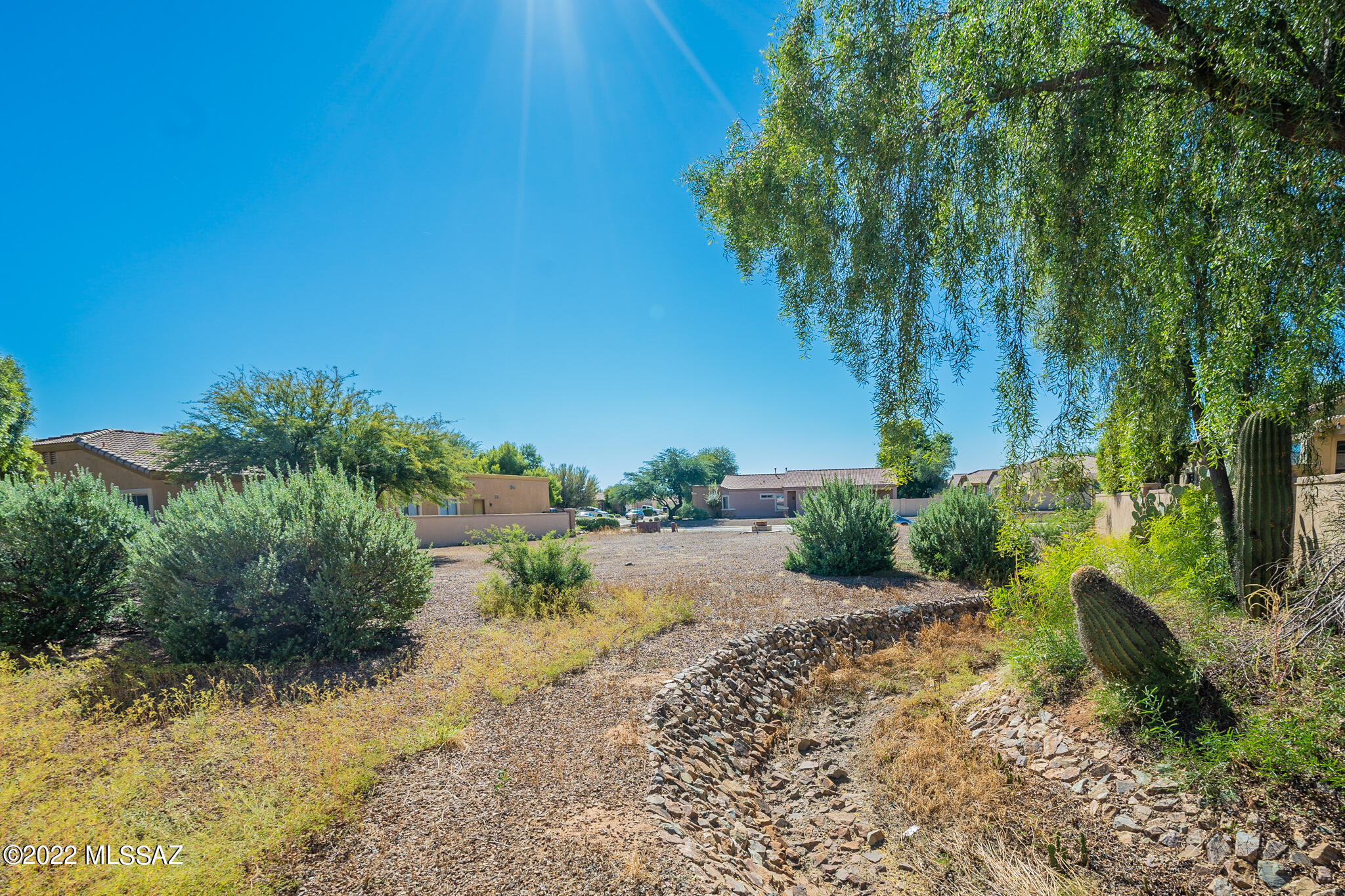 SELLER WILL PARTICIPATE IN INTEREST RATE BUY DOWN WITH LENDER, TO LOWER RATE FOR BUYER. Example, current rate 5.875, year one rate, 3.875, year two it goes to 4.875, third year will be note rate of 5.875. Buyer can also refinance at any time. 
Wonderful hard to find 4 bedroom one level home on large lot backing to common area & privacy.
This great floor plan features upgraded kitchen with refrigerator included that opens to family room with surround sound. 
Large primary bedroom and bath, with decorative touches through out.
Home has just been painted and new carpet installed. Don't miss this great buy.