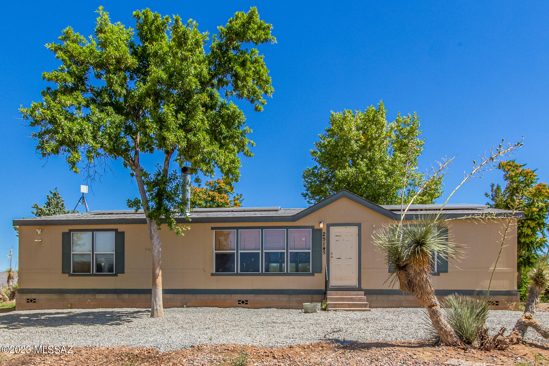 MUST SEE Gorgeous mountain views from this 3 bedroom, 2 bath located on just over 1 acre of fully fenced property.  Split floor plan with walk in closets in each room.  Tons of natural light, wood burning fireplace, long driveway with dog run for your pups.  Private solar panels too!! Paved county road and quick access to I-10