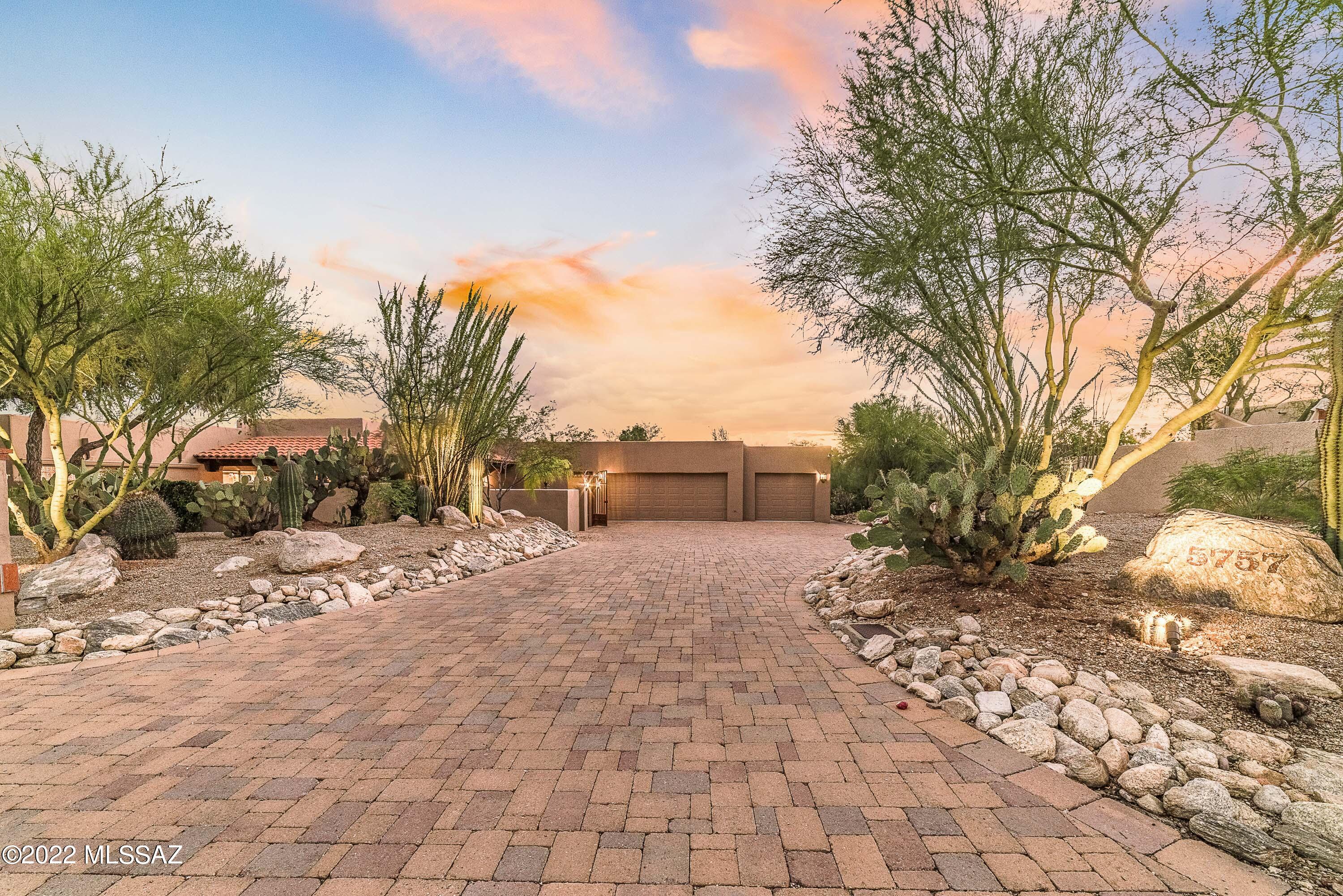 Perfectly nestled into the desert on a private 1-acre lot sits 5757 Camino de la Sombra.  This property embodies the warm and casual nature of the Southwest, while offering a livable layout and expansive outdoor spaces that invite residents into the Tucson lifestyle.  A gracious courtyard offers a quiet reflective space with eastern and northern exposure, leading to the home's entry.  With a split floor plan and adaptable spaces, the 4-bedroom, 3-bathroom property (plus office) accommodates a variety of uses.  Anchored by a well-appointed chef's kitchen, the main living spaces feature wood ceilings and slate flooring.  Setup for entertaining, a bar in the great room flows beautifully to the back patio, while a dedicated dining room offers an ambient space for meals. Throughout the property, there are multiple access points to enter the outdoors, which are truly the crown jewel of this property.  A substantial, covered patio wraps around the home, creating numerous zones for seating and gathering.  Surrounded by dense vegetation, the vast backyard includes a stunning pool & spa, fire pit surrounded by brick hardscape and a sizable area with turf, ideal for pets or kids.  With a 3-car garage, there is ample storage, while a long paver drive provides parking for guests.

Beyond the home, the Shadow Hills neighborhood located in the Catalina Foothills provides both convenience and function for daily life.  With flat streets the setting is conducive to walking.  In a tight radius nearby there is quality shopping, restaurants, grocery, art galleries and hiking trails.  Cyclists can ride an easy 2 miles to pick-up "The Loop," a 135-mile paved path.  Travel time to The University of Arizona is 15 minutes and Downtown Tucson is under 20 minutes.