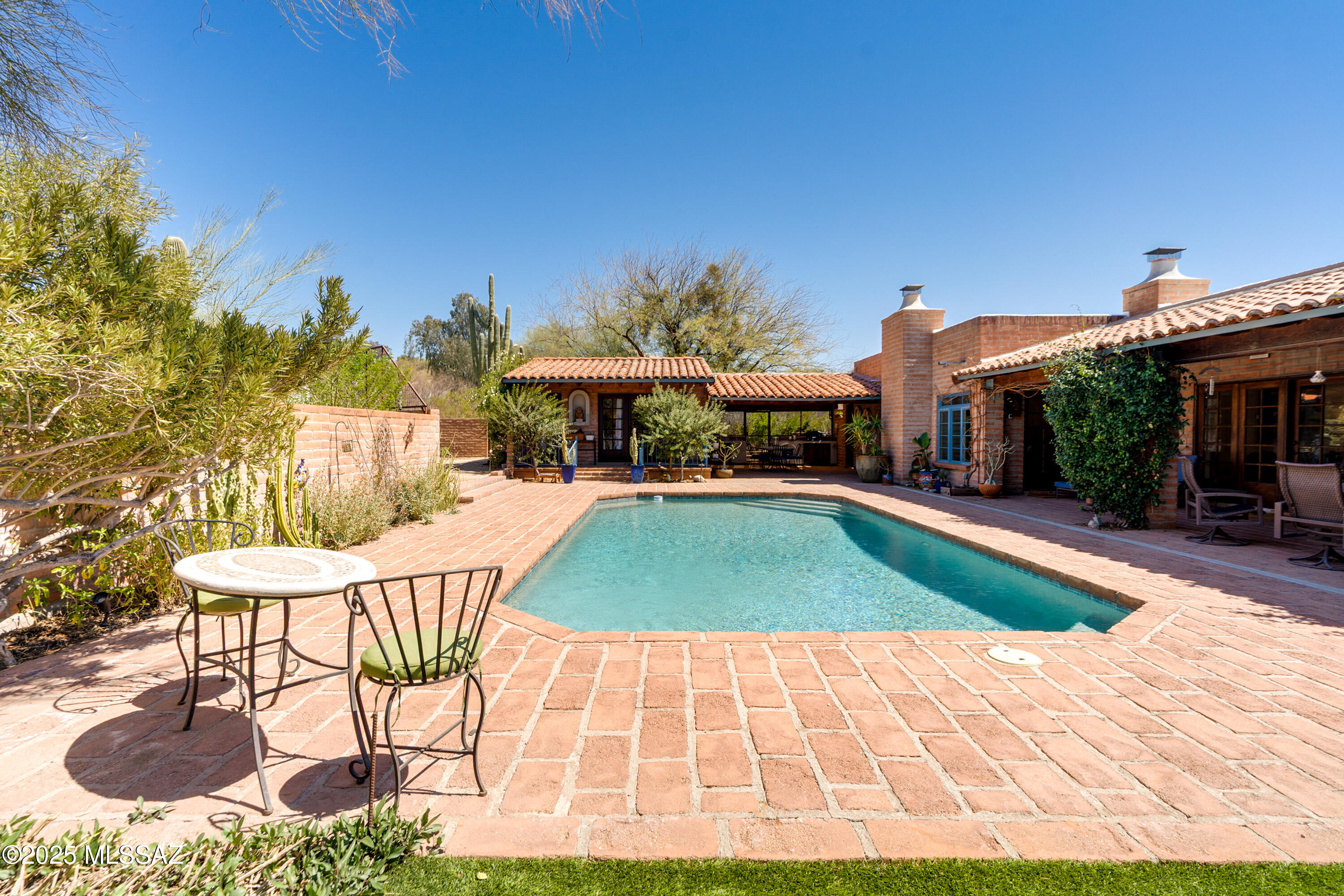 Privacy & Beauty Abound In This Secluded Burnt Adobe Hacienda.  This Breathtaking Estate Is Set On 2.3 Acres In The Heart Of The Sought After Tucson Foothills.  This 4 BDRM, 4.5 Bath Home Has 4261 SF, Including A Newly Remodeled Guest House Ideal For Visitors Or Rental Income w/Picturesque Views Of The Catalina's, Plus Beautiful Hickory Wood Floors, French Doors & 4 Fireplaces.  Outdoor Enthusiasts Will Love The Resort-Style Pool & Hot Tub All Set Within A Lush Audubon Society Certified Sanctuary Garden.  The Remodeled Primary Suite Features A Beautiful Gas FP, A Spa Inspired Bathroom & A Private Patio Garden. This Gorgeous Desert Oasis Retreat Is Truly An Entertainer's Dream And Is Perfectly Located Just Minutes From La Encantada, St. Philips Plaza, The Univeristy of AZ & More! Must See!