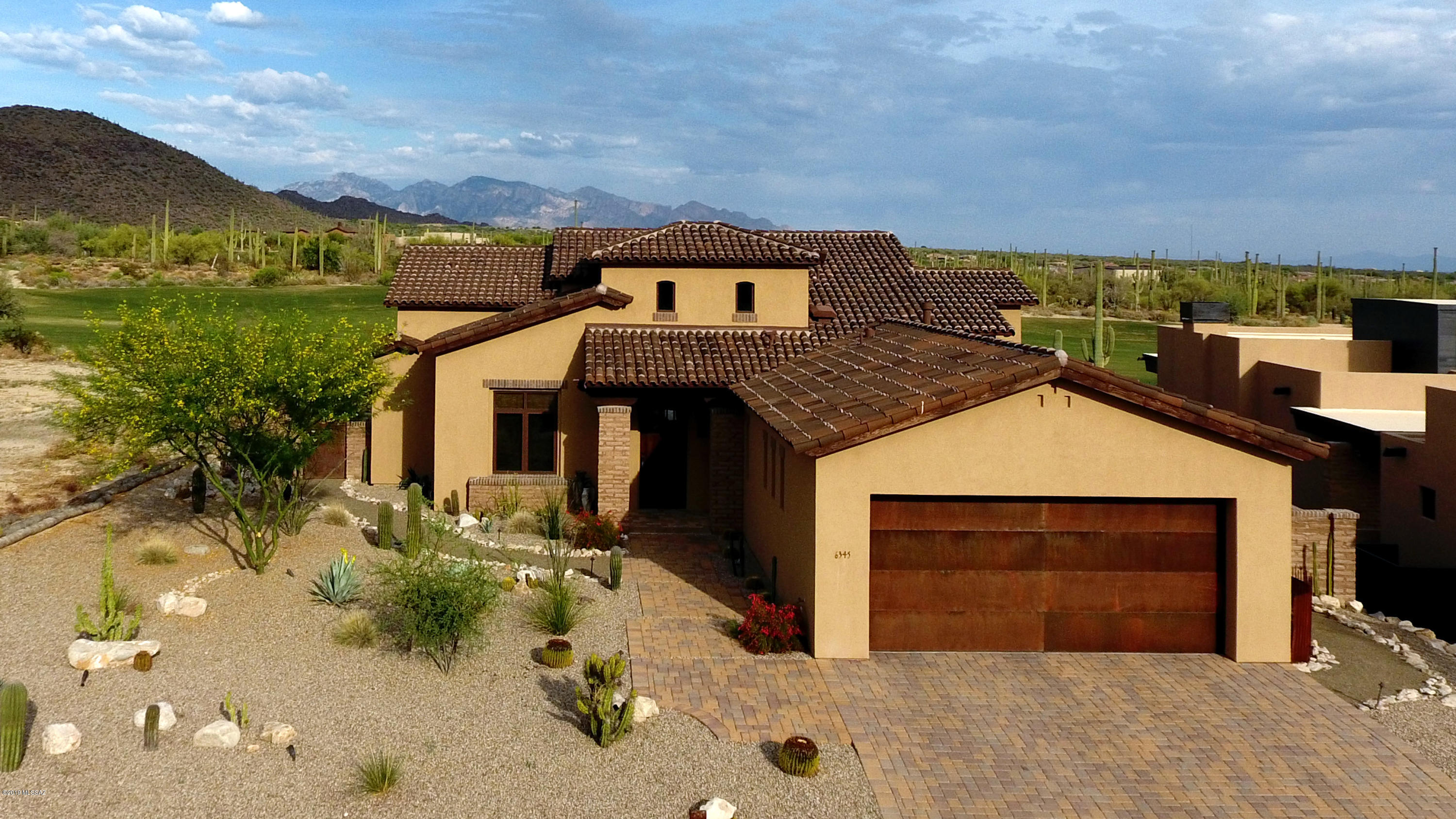 Immaculate Custom Home within the gates of The Ritz-Carlton, Dove Mountain. Stunning backyard with Golf Course, Mountain, City and Sunset Views! Stunning pool and spa, Entertainer's Delight. Interior spaces were carefully designed with high-end finishes, including natural stone floors throughout, Sub-Zero/Wolf Appliances and so much more. Enjoy access to The Ritz-Carlton Amenities, Golf Club and Concierge Services.