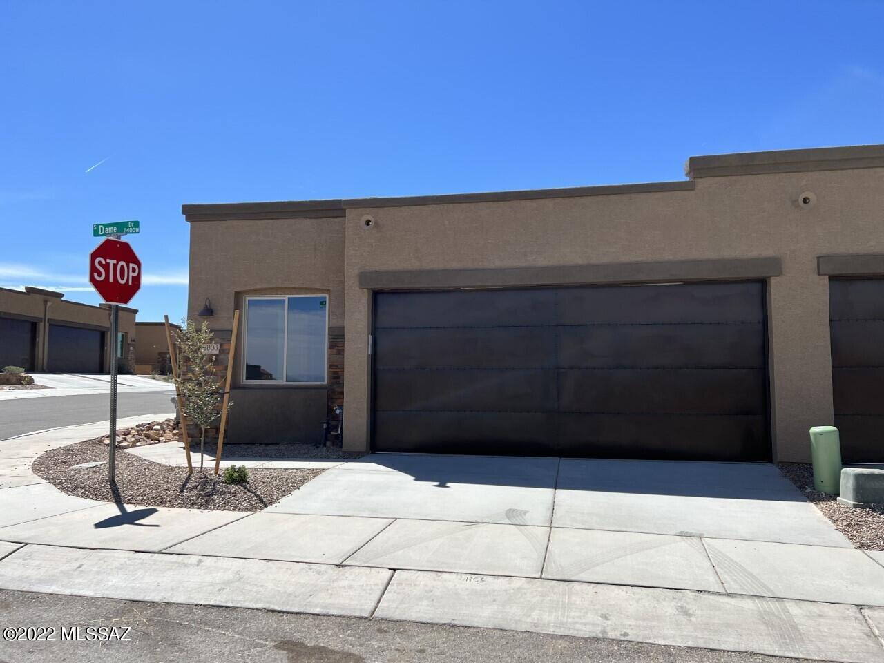 Live in one of the smallest neighborhoods in Green Valley and enjoy beautiful south facing views from your back yard, in this LAST luxtury townhome. Just steps away from the Canoa Ranch Golf Course, and just minutes away from trails and the wonderful picturesque village of Tubac. This spacious townhome has a 2nd Owners Suite with a full bathroom, 2 ft. ext. on 2 car garage, white kitchen cabinets, large pantry, 8ft doors, 10 ft. ceilings, powder room, and many more beautiful upgrades. Perfect for a winter visitor due to the ''turn key'' HOA.  One of the last remaining homesites in the Villas, don't wait on making your Green Valley lifestyle dreams a reality.