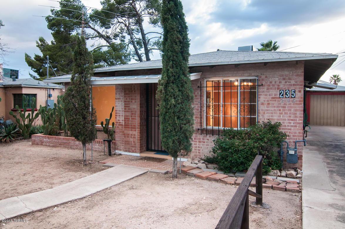Wonderful solid brick MIDCENTURY bungalow full of character including pine ceilings, crown molding, and textured wood walls. Ceramic tile throughout. Antique stove functions and conveys with home. Walking distance to U.A., Bob Dobb's, Rincon Market and everything Sam Hughes has to offer!