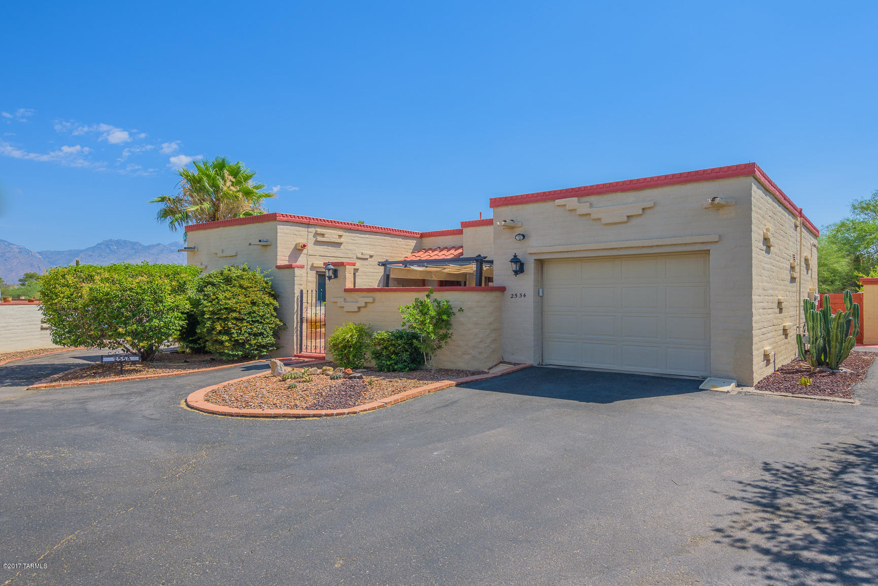 Grab this charming 2 bedroom townhouse in the desired Colonia Verde! Fabulous location for dining, entertainment, shopping, and close to Sabino Canyon for morning hikes. Master bedroom with ensuite has a lovely den/office shared space - complete with adobe fireplace that will warm your heart. All seasons will be appreciated here with an Arizona room that leads to your private courtyard where you can enjoy morning coffee or late night stargazing. Don’t miss out on this cute home offering lovely views of desert wildlife, walking trails through the neighborhood, community pools and clubhouse. HOA includes water and landscaping outside the courtyard walls! Come visit your next home in beautiful NE Tucson!