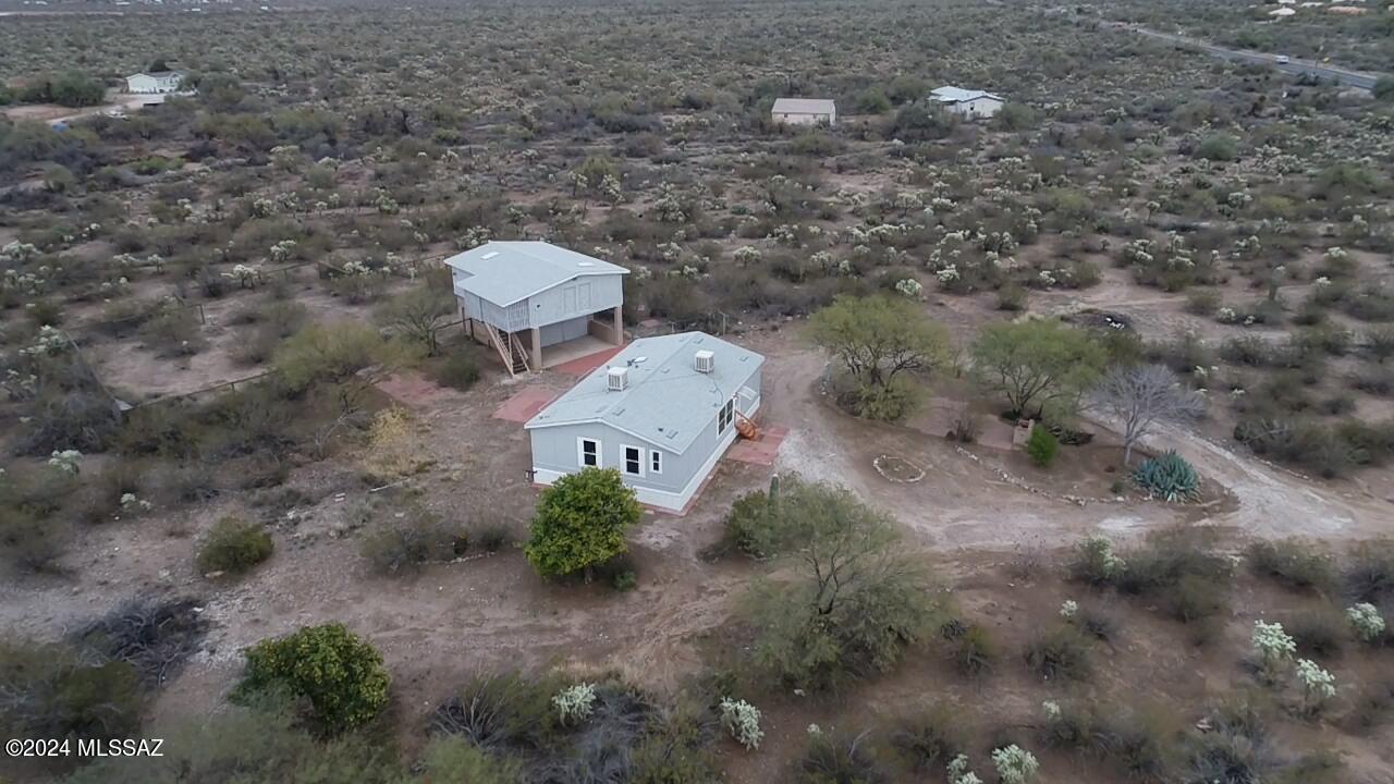RANGE PRICED FROM $285000-$295000 Here is a great property on 3.61 acres  3 bedroom 2 bathroom open floor plan. Upgraded kitchen, and bathrooms.  Upgraded flooring. Property has a detached barn 600 sq foot garage/workshop and a 888 sq foot loft area, built with slump block and steel.  Beautiful views and acres of buildable land.  Shared well, fruit trees, and fenced horse facilities. Just off Sahuarita road so you don't have a long dirt road to go down.  Very desirable and hard to find property.