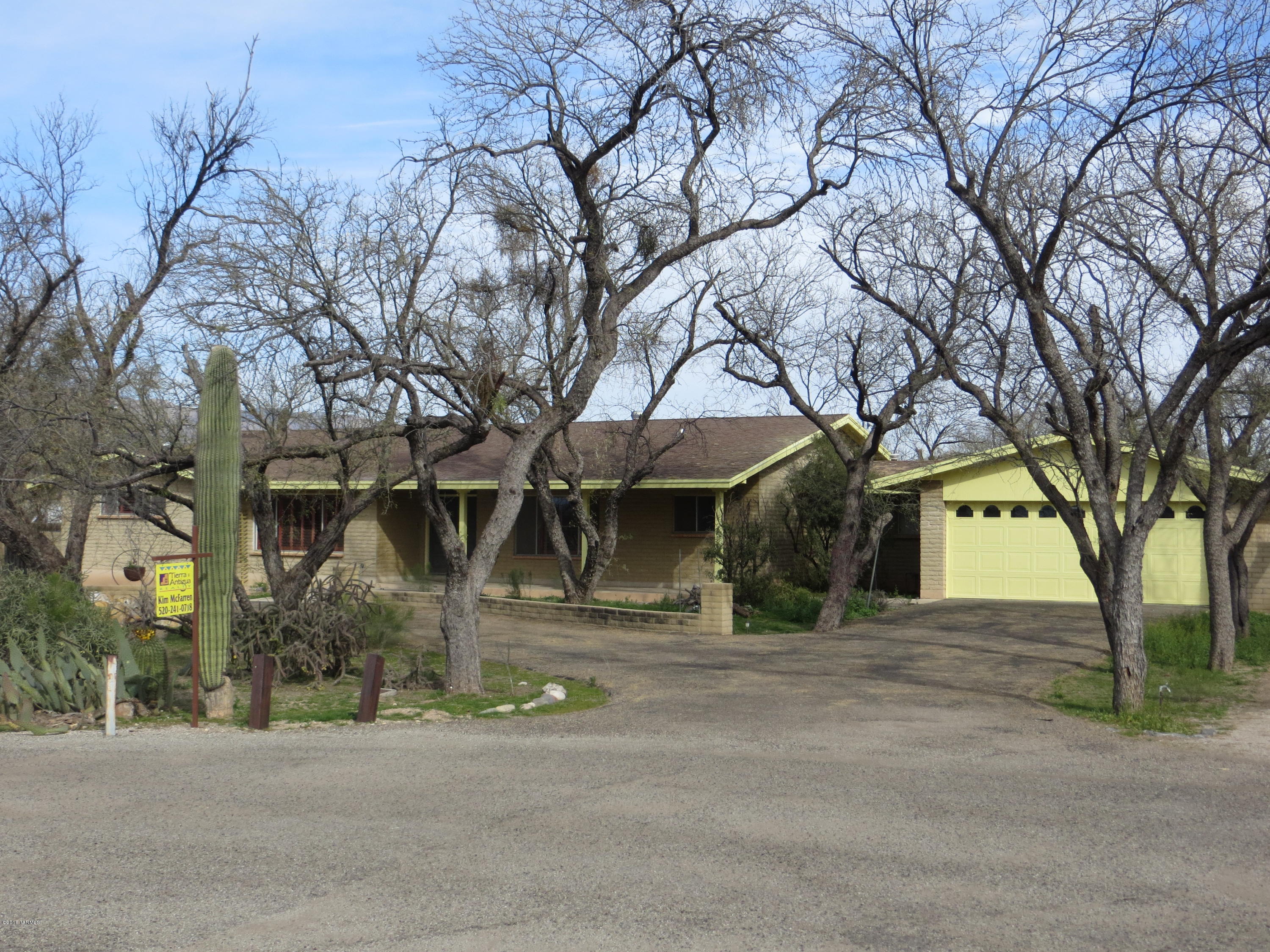 Large home in beautiful Woodland Hills on nearly an acre. This home has 2 large bedrooms with huge walk in closets and 2 big baths, and an addition of a 3rd bedroom, guest quarters, or office with its own bathroom and kitchenette. The possibilities are endless! This home has AC, central vac system, fireplace and a large brick patio. This is a perfect opportunity to purchase a home in this abundant mesquite filled neighborhood close to shopping, restaurants,and Udall park! Home is being sold AS IS.