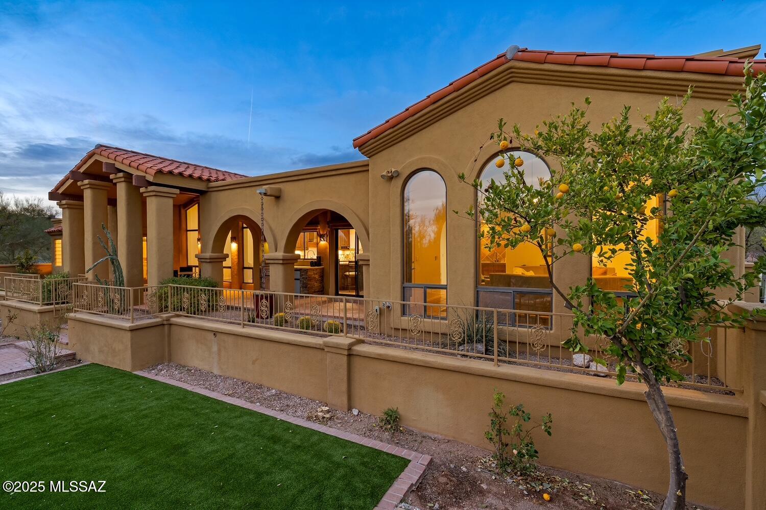 Nestled in the guard gated community of Cat 10, this Mediterranean style home is a tranquil retreat in the heart of the Foothills. Enter through the courtyard with kiva fireplace to this gracious Four bedroom and Three bathroom residence. Vaulted ceilings, an updated gourmet kitchen, and two interior fireplaces make this home as cozy as it is elegant. Sprawling outdoor living spaces and mature landscaping create the perfect backdrop for enjoying our Tucson Lifestyle.