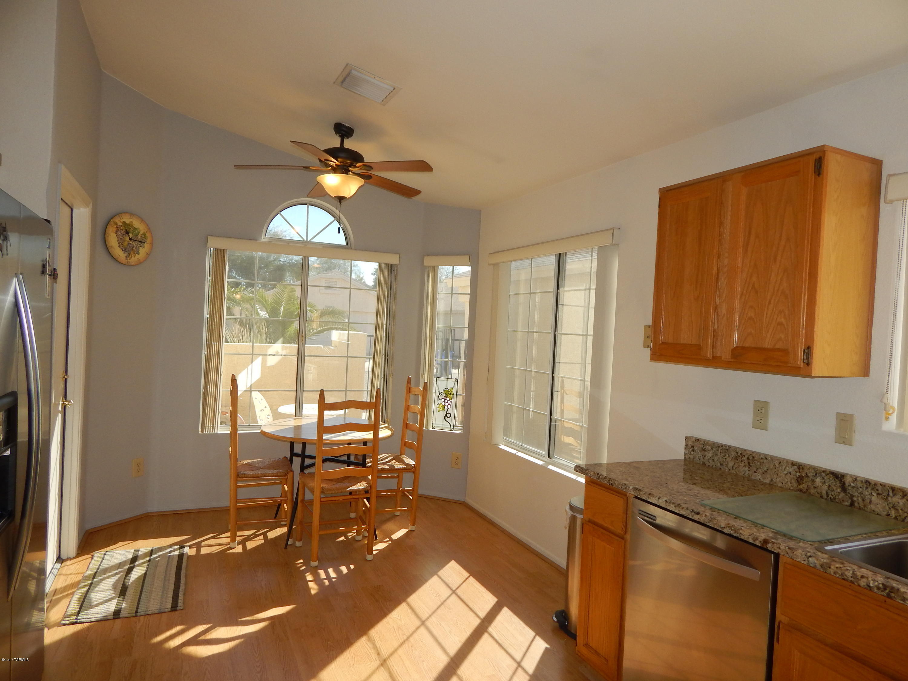 This gem won't last long! Meticulously maintained and walking distance to the NW YMCA, shopping and highly ranked charter school and with easy access to I-10.  The obvious updates include the kitchen and baths, with new granite and acrylic counters, fixtures and appliances. Fresh paint throughout, clean as a whistle, lovely Berber carpet, wood laminate flooring and tile, extra storage in garage, solar screens on all windows, recently replaced HVAC and water heater. The list goes on and on - check out the amenities list under the Documents tab! Better than new - take a look today!