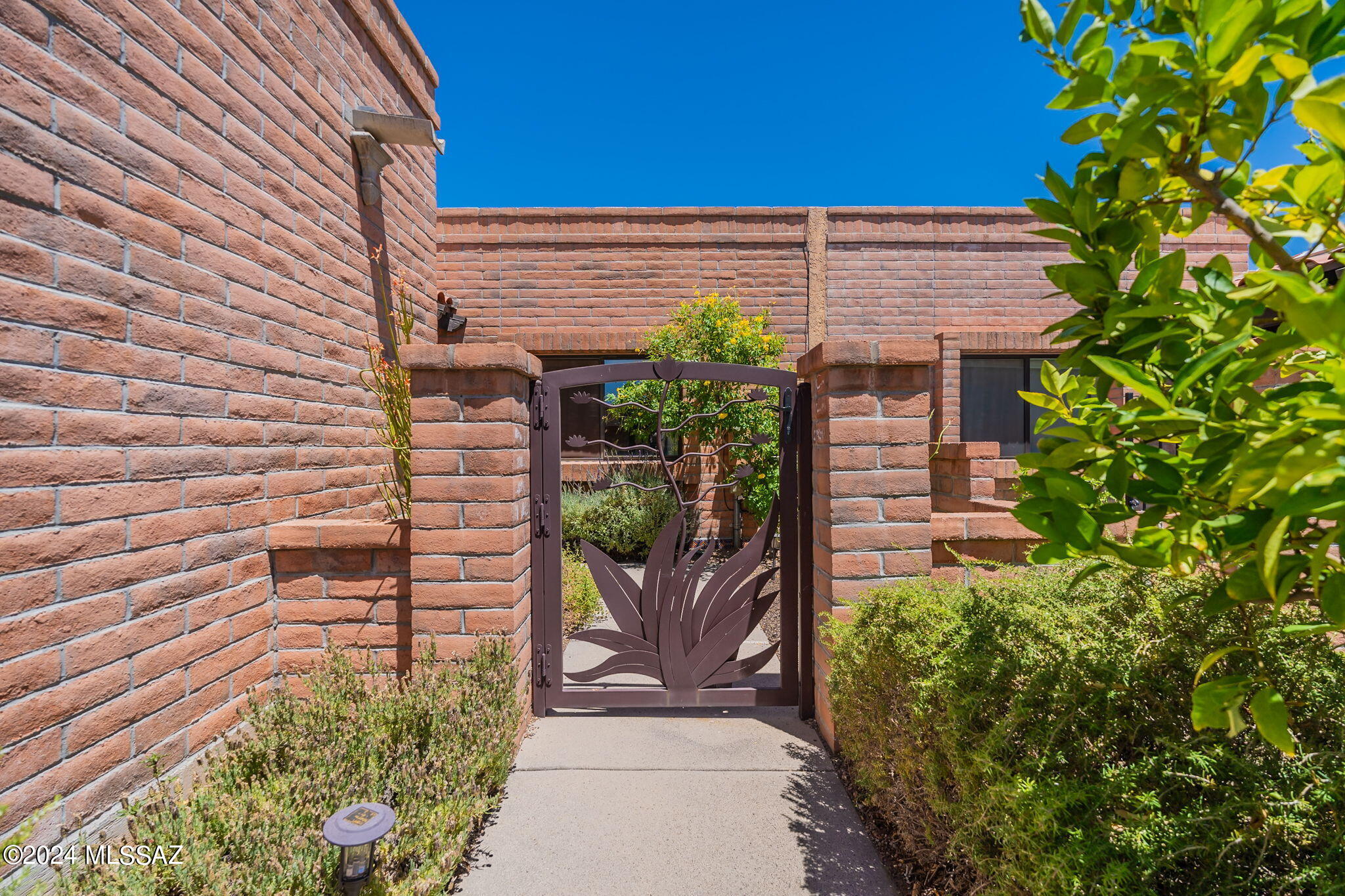 Nestled in the picturesque foothills of Tucson, this beautifully updated townhome blends modern amenities with southwestern charm. The bright, open kitchen/living space features new appliances, new quartz counter-tops & large island, new soft-close cabinets, and a fireplace. Spacious primary bedroom with a walk-in closet. Both bathrooms fully remodeled. The covered patio extends the living space outdoors. Enjoy the beautiful community pool and pickelball/tennis courts. You will fall in love with the Fairfield in the Foothills community.  New hvac 2021.