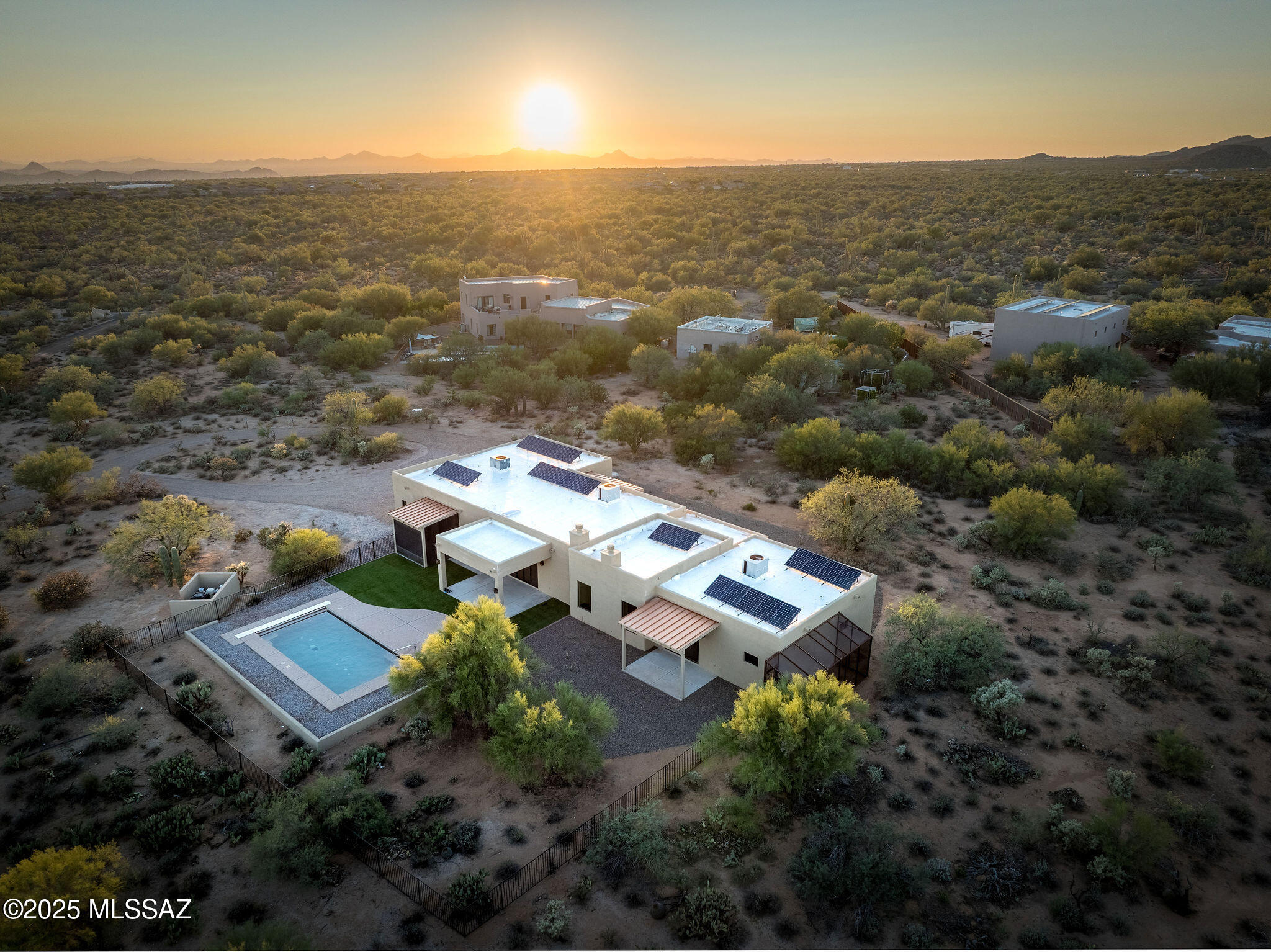 Welcome to your own private retreat on 3.31 acres, where timeless updates blend seamlessly with the beauty of the Sonoran Desert. From the moment you arrive, you'll be captivated by the unobstructed views of the majestic Pusch Ridge mountains. Imagine sipping your morning coffee as the sun rises over the peaks, or winding down in the evenings surrounded by the tranquil glow of desert skies.
Inside, the soft neutral palette creates an inviting and serene atmosphere. The spacious living room features a striking wood-beamed ceiling, and a warm fireplace is a wonderful way to greet your guests.  You then flow effortlessly into the expansive kitchen with center island and into the cozy family room with an additional fireplace and dining area — perfect for gatherings both large and small. The spacious and luxurious primary bedroom offers breathtaking mountain views, with a spa like bathroom complete with a spa-like soaking tub, and fully tiled walk-in shower. Guests will enjoy their own private retreats with a junior suite featuring an oversized bath and walk-in multi-jetted shower.  It doesn't stop there, there is an additional full bathroom with gorgeous tiled walk-in shower.
Practicality meets elegance with a bright and spacious laundry room/pantry, a convenient drop station off the garage, and a dedicated office with a Murphy bed for versatility. A powder/pool bathroom adds to the thoughtful design. Step outside to a beautifully landscaped yard that enhances the natural desert scape, providing the perfect balance of comfort and connection to nature.
This is more than a home  it's a lifestyle of peace, beauty, and endless Arizona sunsets.