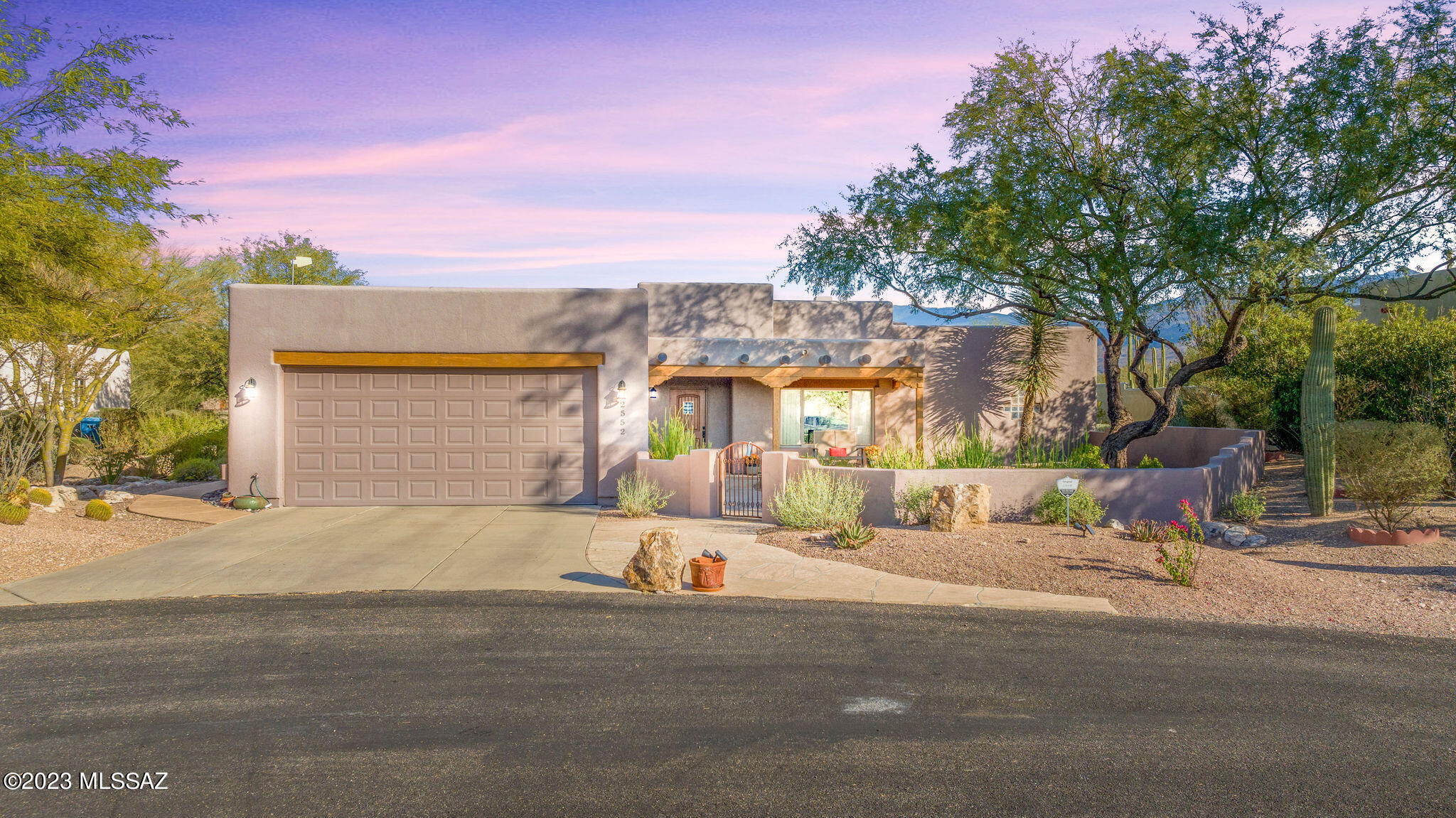 Amazing opportunity for remodeled turnkey 2,292 SqFt, 3 bed/2 full bath split floor plan, single story, no stairs/no steps, 2 X 6 energy efficient construction, modern Santa Fe with attached 525 SqFt post tension finished garage on spacious .31 acre lot, located at end of quiet cul-de-sac with panoramic mountain views in acclaimed Tanque Verde school district in Northeast Tucson. Pride of ownership shines on this stunning home, featuring: E/W orientation, concrete driveway, roof recoated 2023, concrete walking path to front gated courtyard, irrigation and mature landscape. Enjoy tranquil Tucson sunsets under your West facing extended covered patio complete with flagstone and copper covered Vega beams. Inside buyers will find soaring 20 ft real wood plank ceiling in massive living room, recently added energy efficient Milgard double pane windows throughout ($11K), new energy efficient doors, 18' tile, beehive gas fireplace, updated Pex plumbing all the way to street connection, wireless alarm w/motion sensors, cell phone booster on roof, 2018 Rheem 14 SEER gas HVAC ($13K) with surge protector, Honeywell digital thermostat, internal laundry room with wet sink and storage; grounded electrical, recessed lighting, LED lighting and ceiling fans. Remodeled entertainer's dream kitchen with one of a kind, hand carved polished mesquite wood bar, bar seating, Staron copper flake counter tops, custom handmade dovetail hardwood kitchen cabinets with soft close and bottom cabinet pull-outs X4, custom spring assisted mixer cabinet lift, stainless steel appliance package, Bosch gas stove, Bosch convection oven, undermount dimmable lighting, adjacent to dining area. Retreat to remodeled primary suite with two walk-in closets w/built in storage organizers, executive height dual sink Staron countertop handmade wood vanity with matching floating faucet and hardware, roll in tiled shower, custom wood built-in cabinet, custom shelving, workstation and energy efficient door out to private covered patio. Spacious guest bedrooms on opposite side of home provide perfect solution to multigenerational living, East facing guest bedroom has unique dog door that goes into custom gated kennel in backyard. Remodeled full guest bathroom with custom handmade executive height wood vanity dual sink Staron counter top with floating faucet and hardware, tiled shower/tub with sliding pocket door to second guest bedroom with large walk-in remodeled closet. Private backyard boasts long extended covered wood beam patio over flagstone, plumbed for gas for barbeque/grills, gas firepit, Rincon mountain views, programmable irrigation, professionally graded tiered backyard with raised flower beds, granite rip rap, added drainage (water controlled away from home), mature vegetation and relaxing hot tub with new heater and motor 2023, all surrounded by tall masonry stucco privacy walls.
Fantastic Northeast Tucson location, walking distance to 49er Country Club, pool and golf course, close to groceries and restaurants including the Barnyard Crafthouse & Eatery, short drive to Ville Algere Park, Agua Caliente Park, Reddington Pass and many other hiking trails! Make sure to check out the features list, digitally measured floorplan, CC&Rs plus 10 more documents under the documents tab in MLS. Reasonable $200 a year HOA will be increasing to $218 a year in 2024. The HVAC system is serviced 2X a year, comes with current termite warranty and one year home warranty from Fidelity Home Warranty. Beautifully  remodeled and updated Santa Fe home, ready for new owners to enjoy. Call to make your appointment to view today!