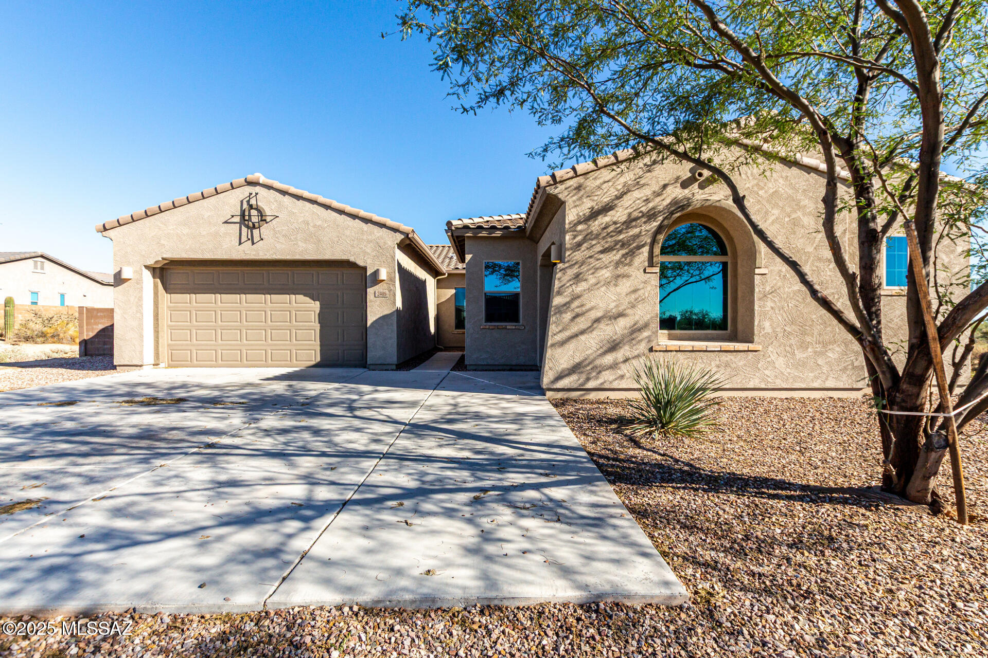 Your dream cul-de-sac home is here! This gorgeous 4-bedrooms 2.5 baths home in Oro Valley's La Mirada neighborhood offers a 3-car garage, private courtyard, & majestic mountain views that provide a picturesque backdrop! Inside, you will enjoy a spacious open layout w/ high ceilings, a soothing palette, recessed lighting, wood-look flooring, & a cozy fireplace. The stunning kitchen boasts granite counters, abundant cabinetry w/ crown moldings, a tile backsplash, stainless steel appliances, walk-in pantry, & an island w/ breakfast bar. The primary bedroom features plush carpeting, backyard access, an ensuite with dual sinks, & a walk-in closet. Relax in the sizable backyard w/ a covered patio & plenty of room to create your ideal outdoor oasis. this incredible gem is a must-see! Agent/Owner