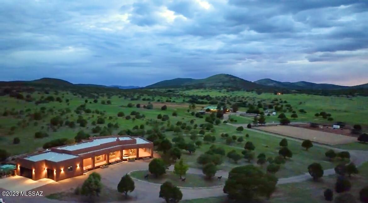 Truly the most remarkable custom built home, guest home and equestrian property. The property boarders Coronado National Forest on five sides, including private gate to access the National Forest for miles of riding enjoyment. The home was built with extreme thought in the design and nothing spared in the quality fixtures, solid wood doors and dual pane Anderson windows. The views are breathtaking from all the windows. A home truly built for the most meticulous. Superlative Equestrian facilities, 4 box stalls with pipe outdoor runs, all metal fencing, tack room, two separate accessory hay barns. Round pen, large arena, 5 paddocks, two pipe catch pens, and the entire 22 acres fully fenced. Additionally, there is a 40 foot sheltered roofed dog run with dog access door to go in and out