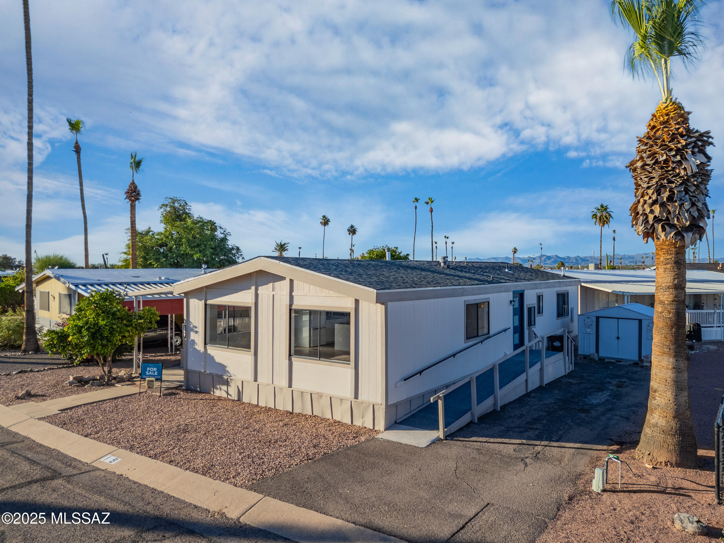 Beautifully remodeled 3-bed, 2-bath home in the highly desirable Bella Capri 55+ gated community Lot # I9. This sale is for the mobile home only—home is located on leased land. Enjoy brand-new updates throughout including a new roof, AC, dual-pane windows, flooring, kitchen and bath cabinets, countertops, paint, skirting, and fully remodeled bathrooms.
Bella Capri offers resort-style amenities including a pool, spa, clubhouse, billiards, shuffleboard, laundry facilities, and planned social events—all within a friendly, active neighborhood. With wide paved streets, off-street parking, and a prime Tucson location near shopping, dining, and golf, this community provides both comfort and convenience. Seller financing available!